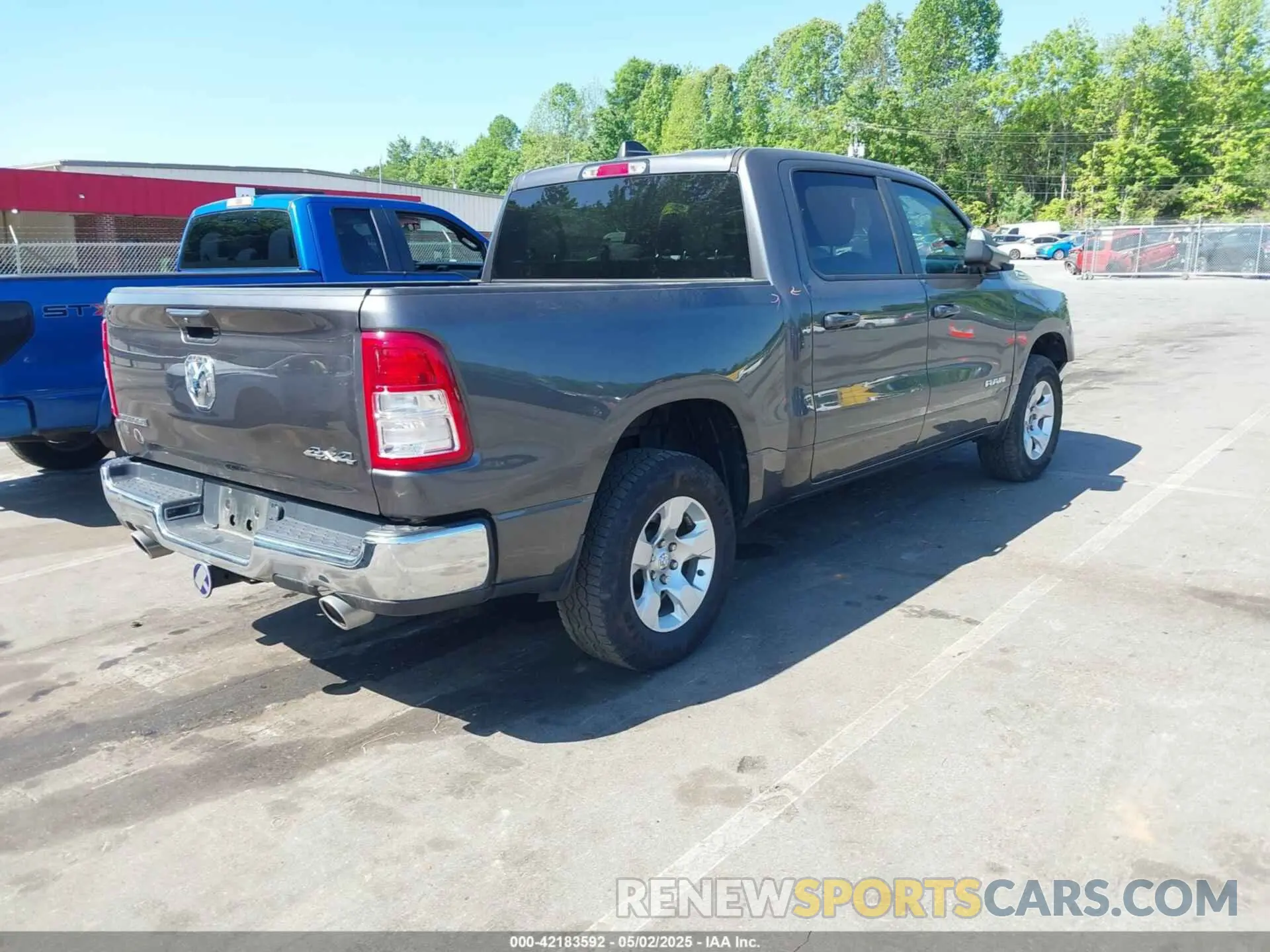 4 Photograph of a damaged car 1C6SRFFT7MN620668 RAM 1500 2021