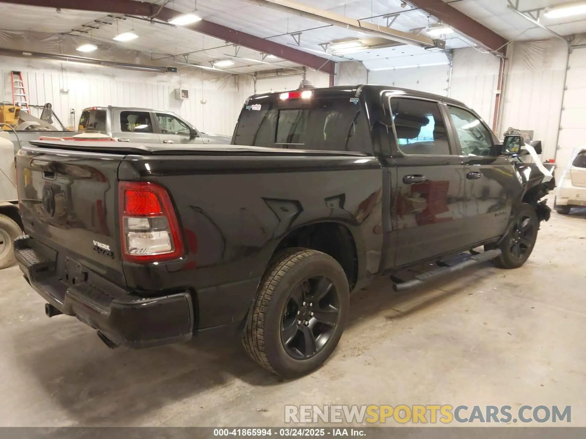 4 Photograph of a damaged car 1C6SRFFT7MN641634 RAM 1500 2021