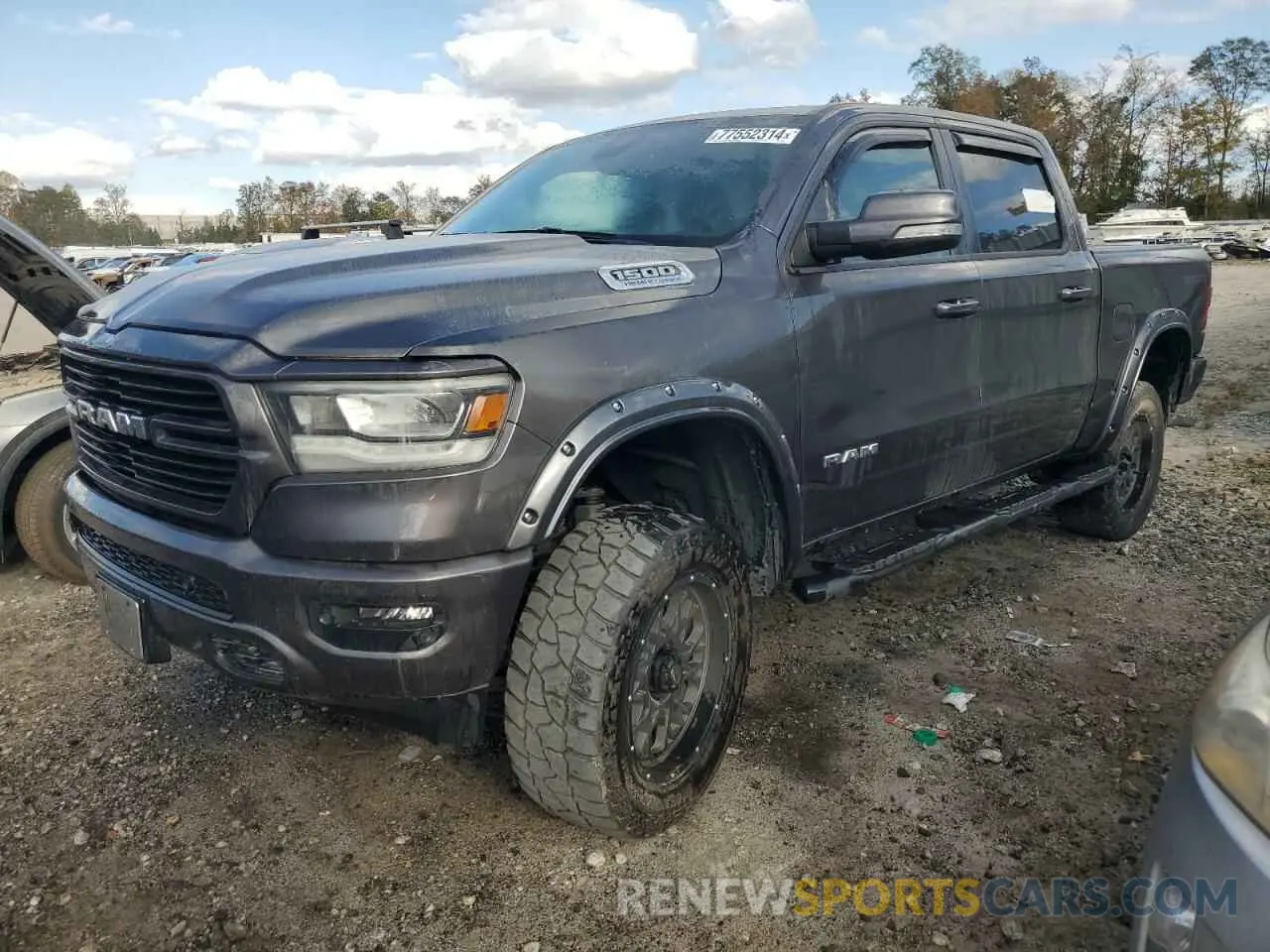 1 Photograph of a damaged car 1C6SRFFT7MN796989 RAM 1500 2021