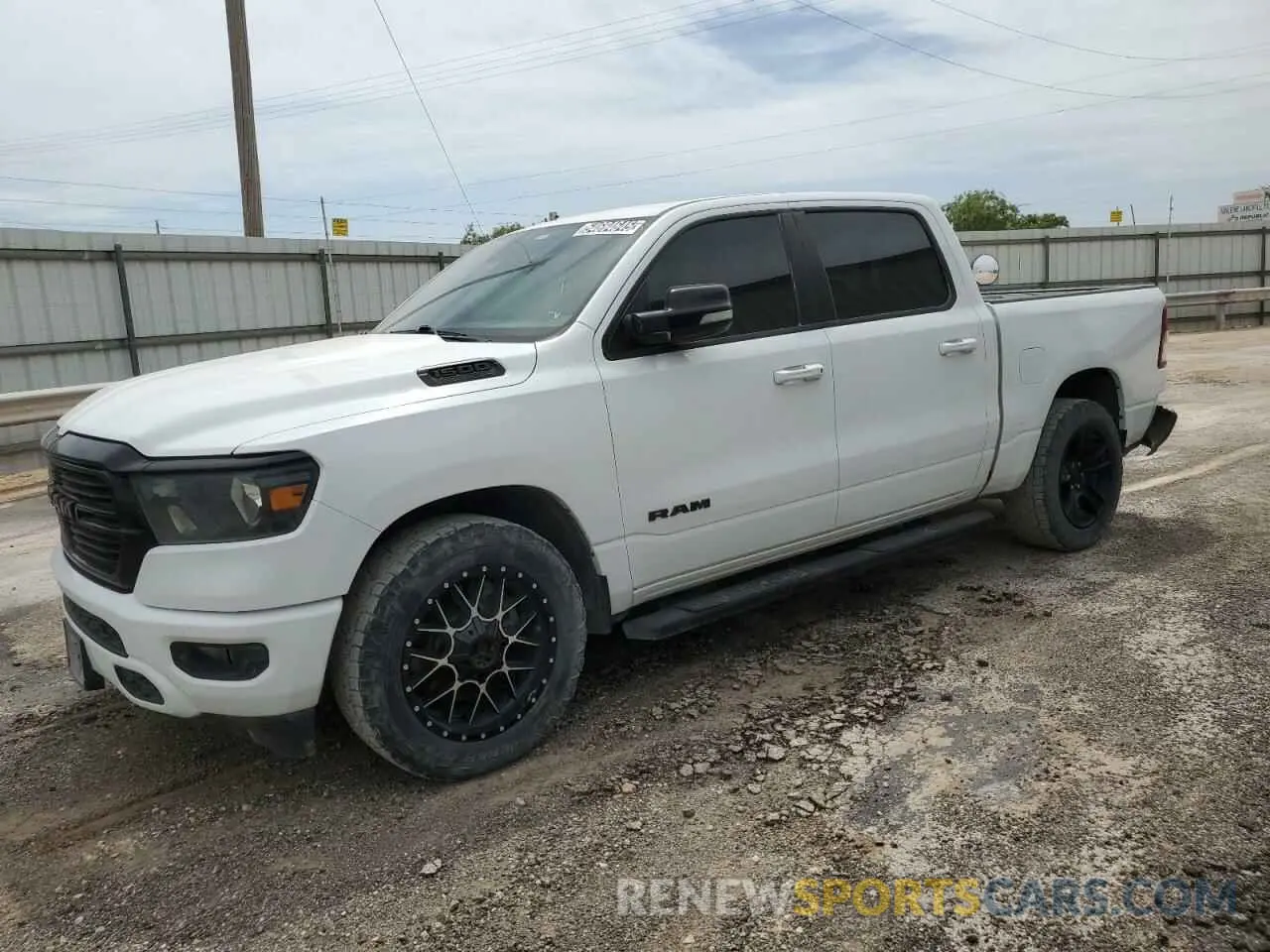 1 Photograph of a damaged car 1C6SRFFT8MN586451 RAM 1500 2021