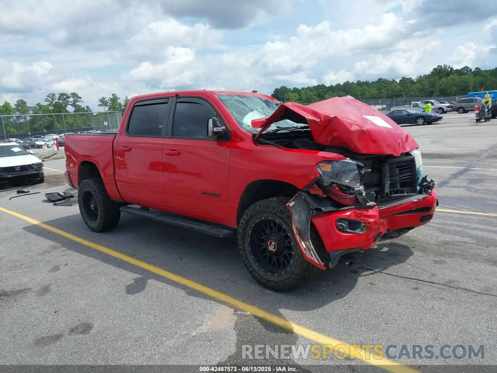 1 Photograph of a damaged car 1C6SRFFT8MN622915 RAM 1500 2021