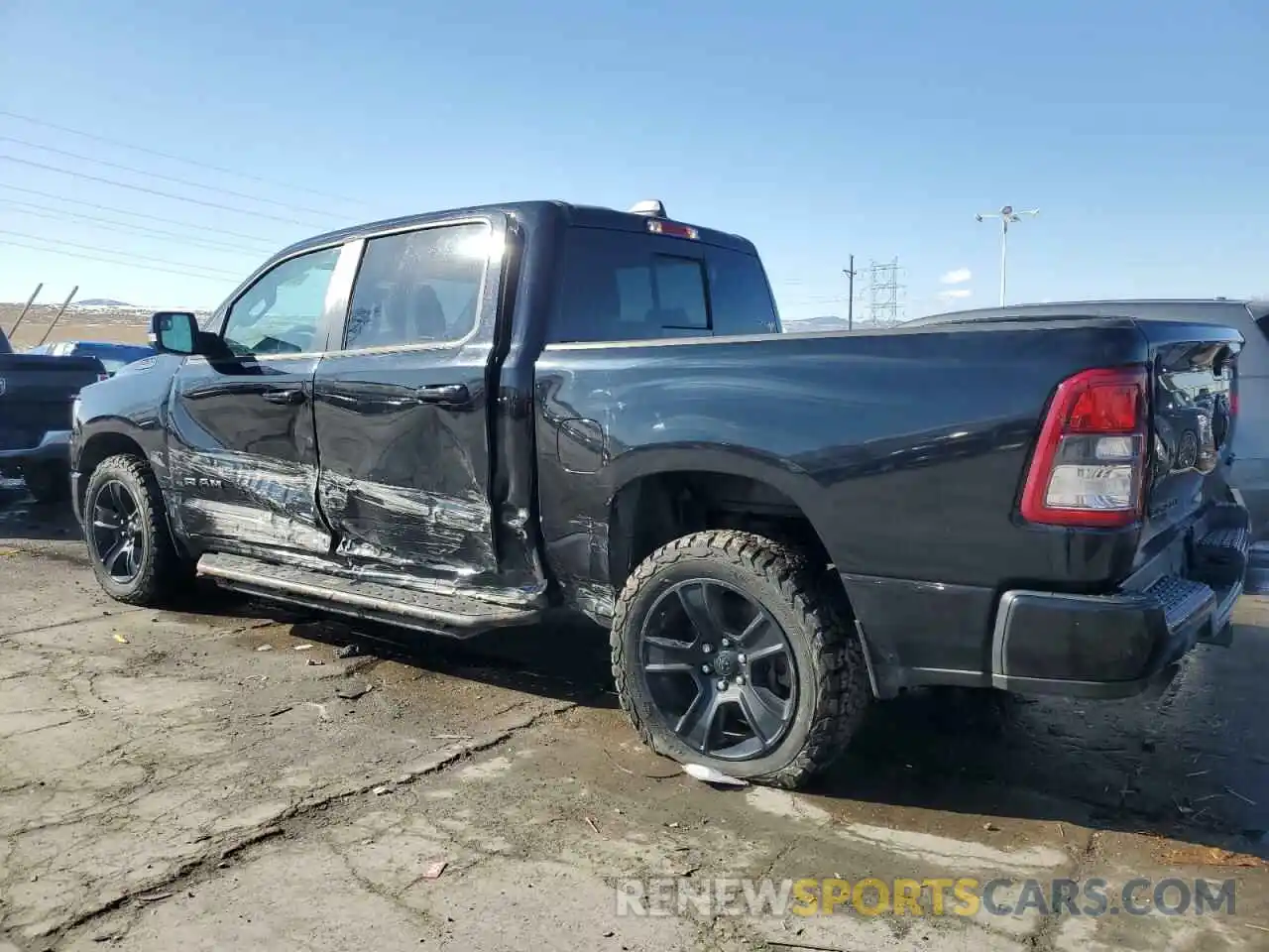 2 Photograph of a damaged car 1C6SRFFT8MN674044 RAM 1500 2021