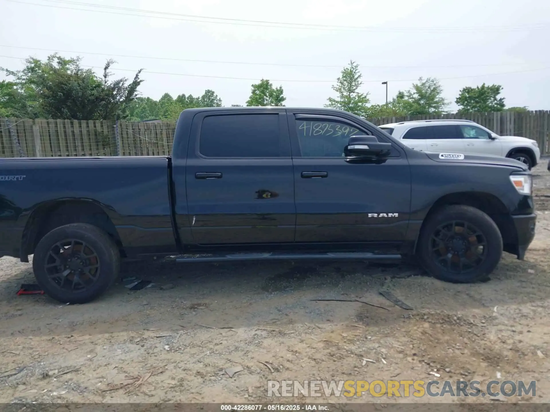 13 Photograph of a damaged car 1C6SRFFT8MN816943 RAM 1500 2021