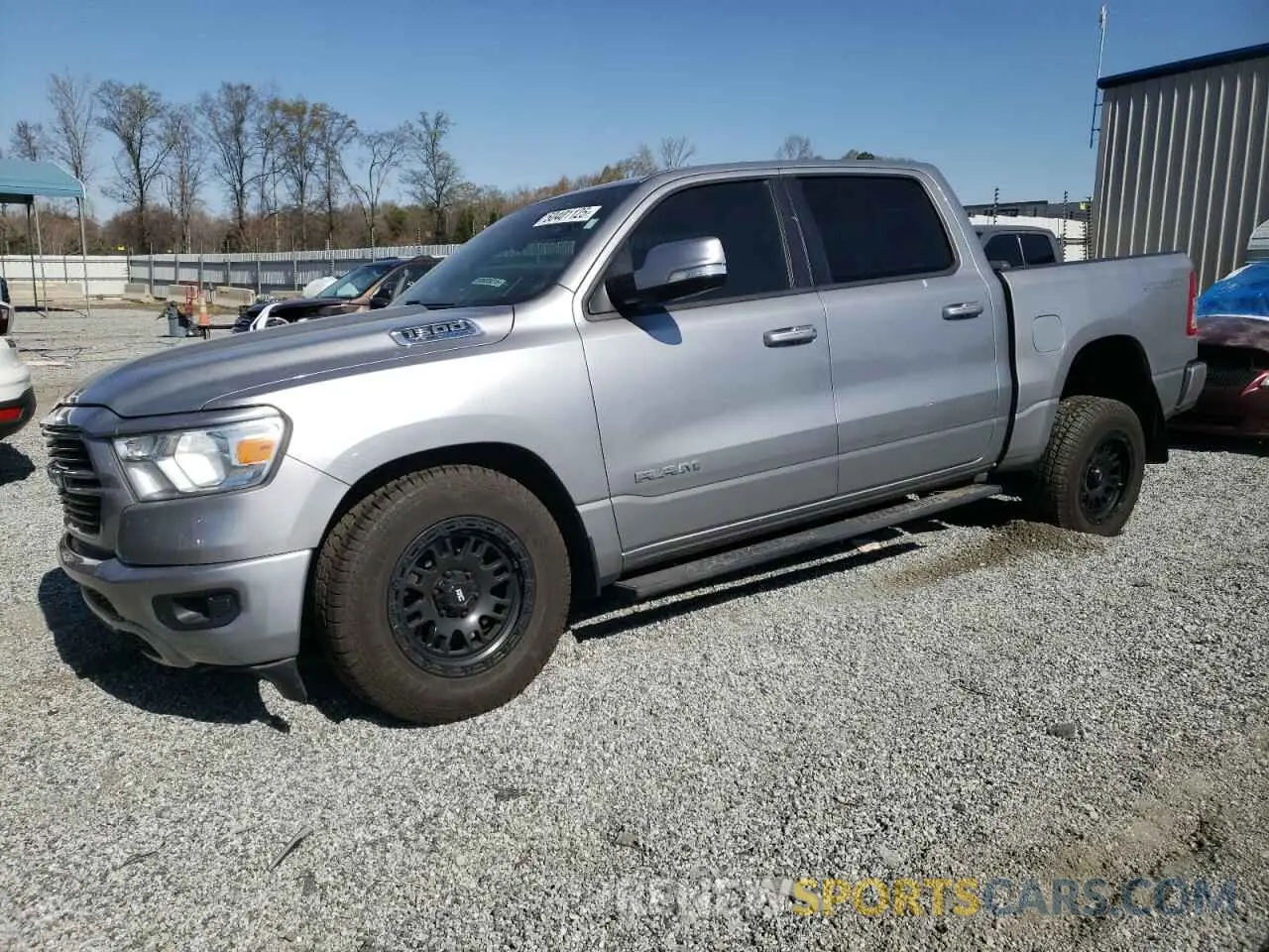 1 Photograph of a damaged car 1C6SRFFT9MN527585 RAM 1500 2021