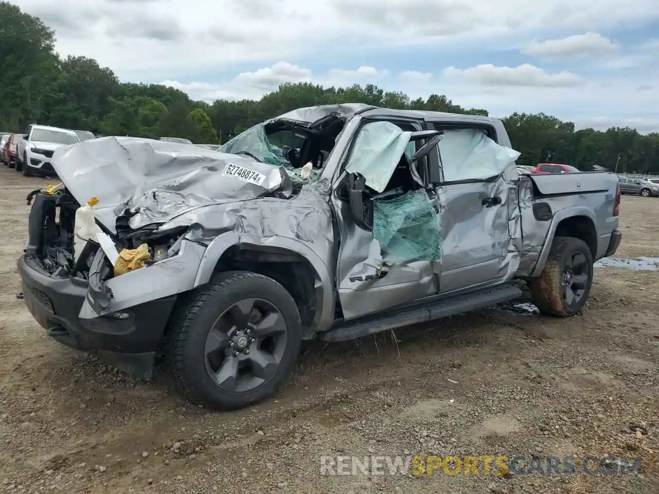 1 Photograph of a damaged car 1C6SRFFT9MN557167 RAM 1500 2021