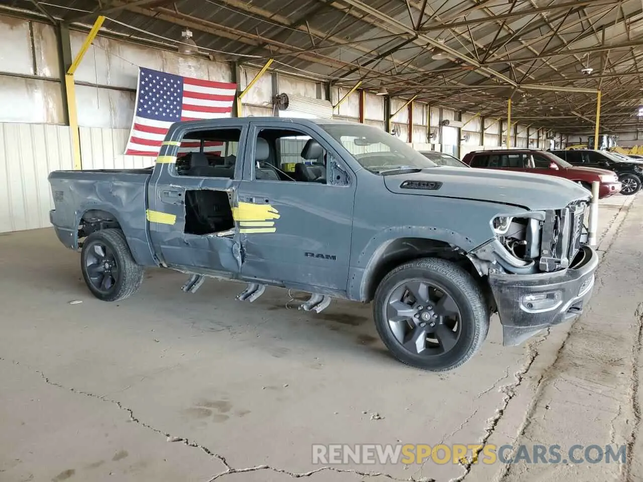 4 Photograph of a damaged car 1C6SRFFT9MN562627 RAM 1500 2021