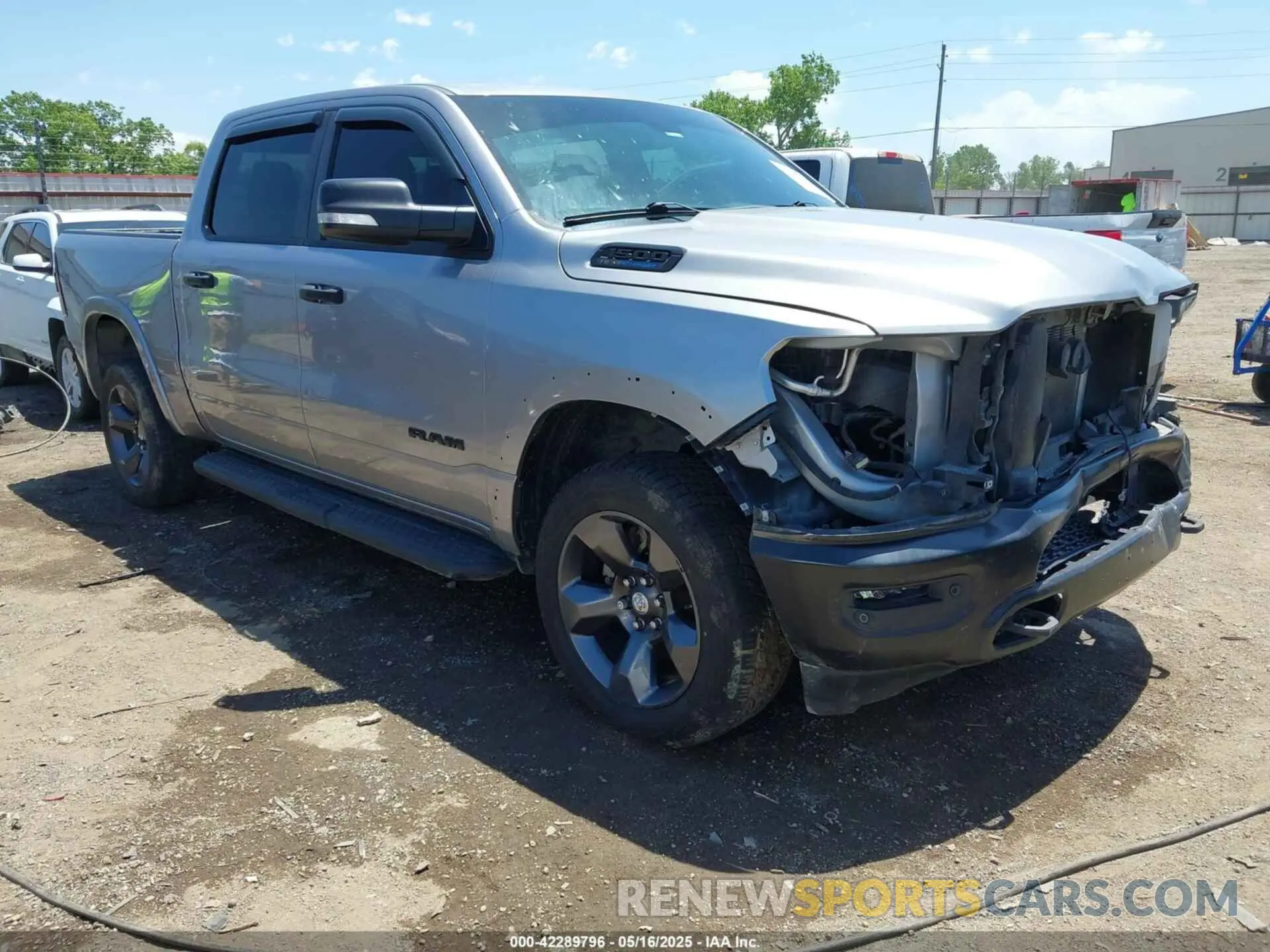 1 Photograph of a damaged car 1C6SRFFT9MN577936 RAM 1500 2021