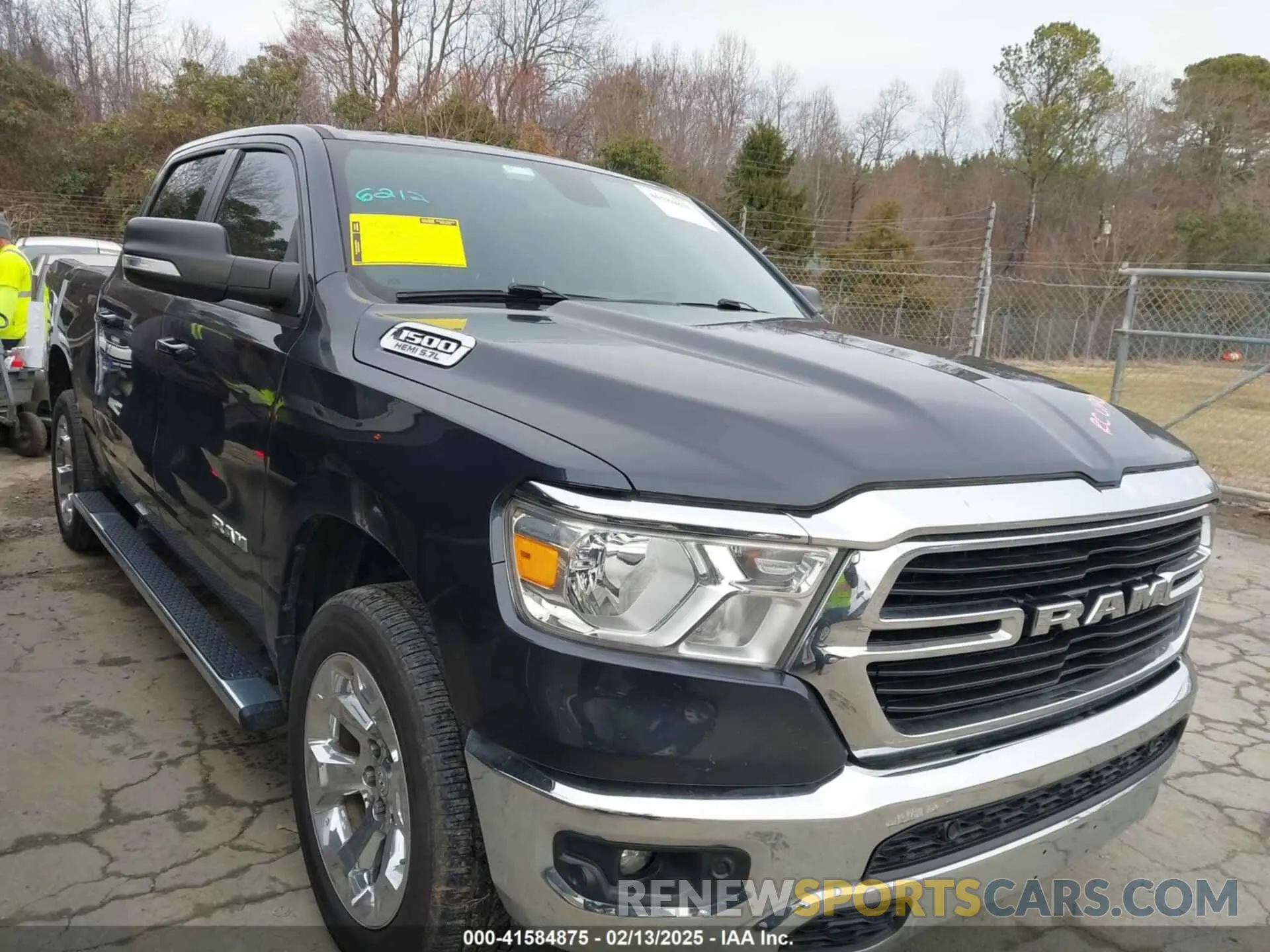 1 Photograph of a damaged car 1C6SRFFT9MN618341 RAM 1500 2021