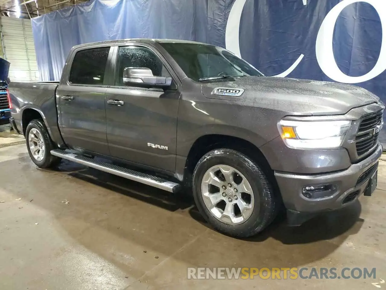 4 Photograph of a damaged car 1C6SRFFT9MN647970 RAM 1500 2021