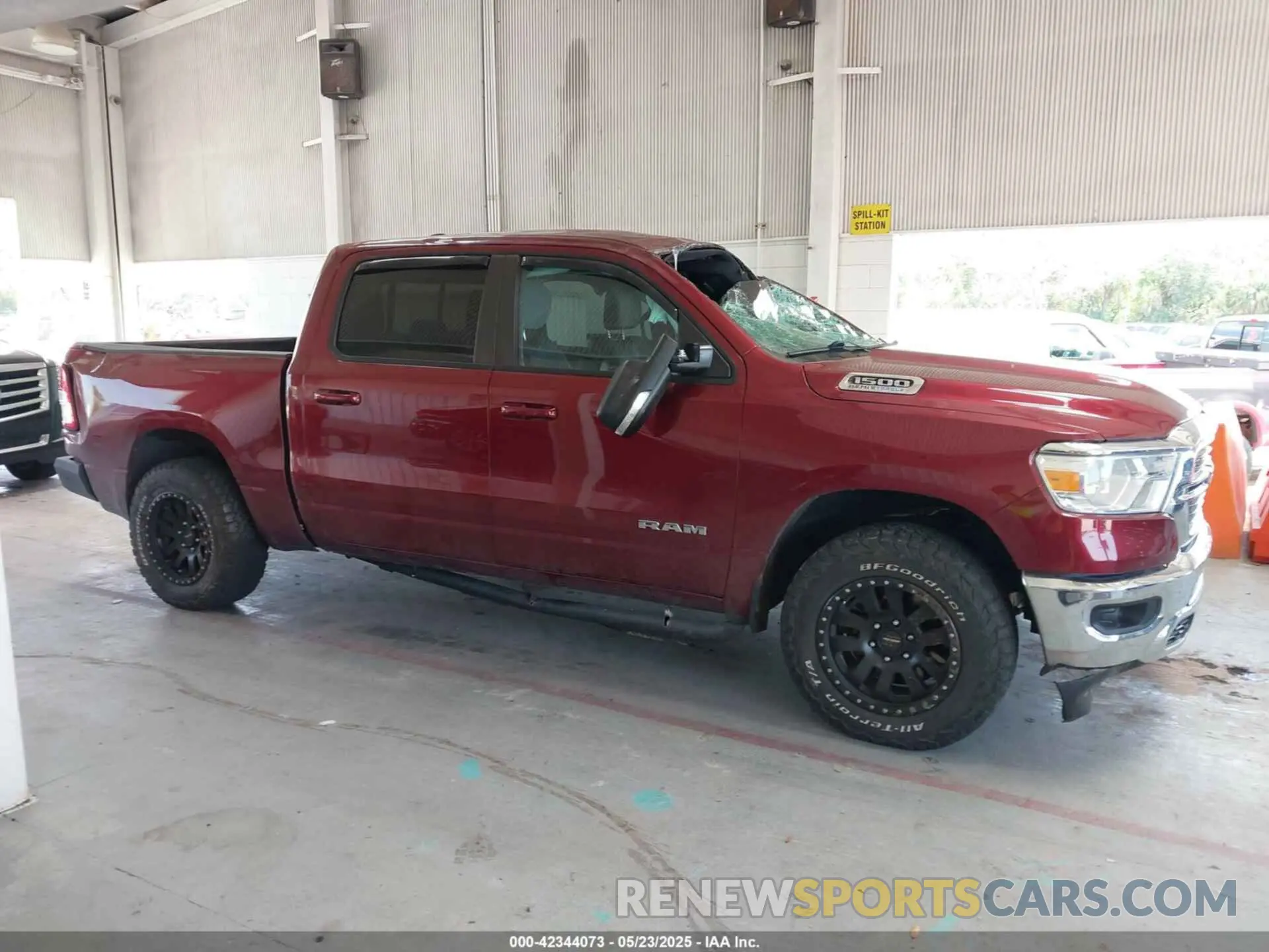 13 Photograph of a damaged car 1C6SRFFT9MN676871 RAM 1500 2021