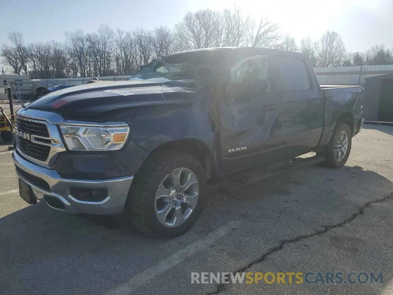 1 Photograph of a damaged car 1C6SRFFT9MN692262 RAM 1500 2021