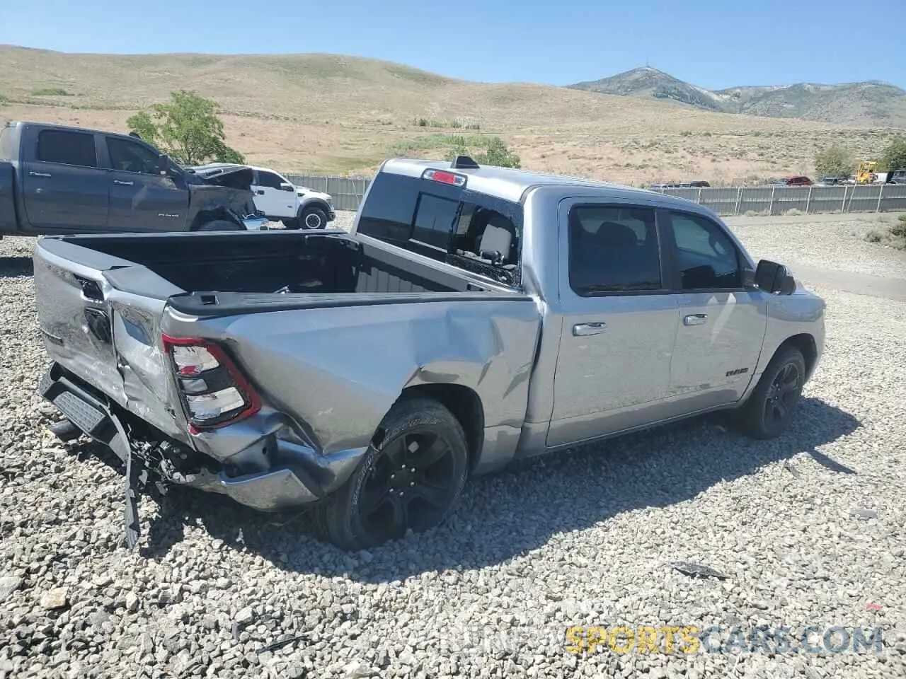 3 Photograph of a damaged car 1C6SRFFTXMN537235 RAM 1500 2021
