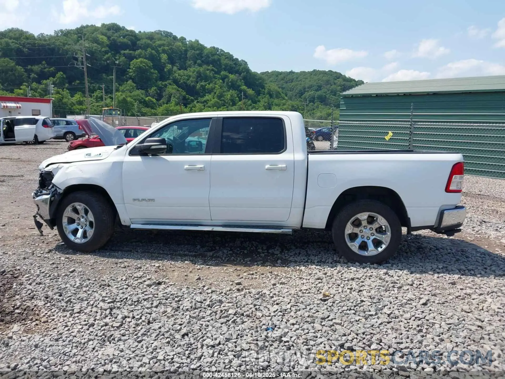 13 Photograph of a damaged car 1C6SRFFTXMN728301 RAM 1500 2021