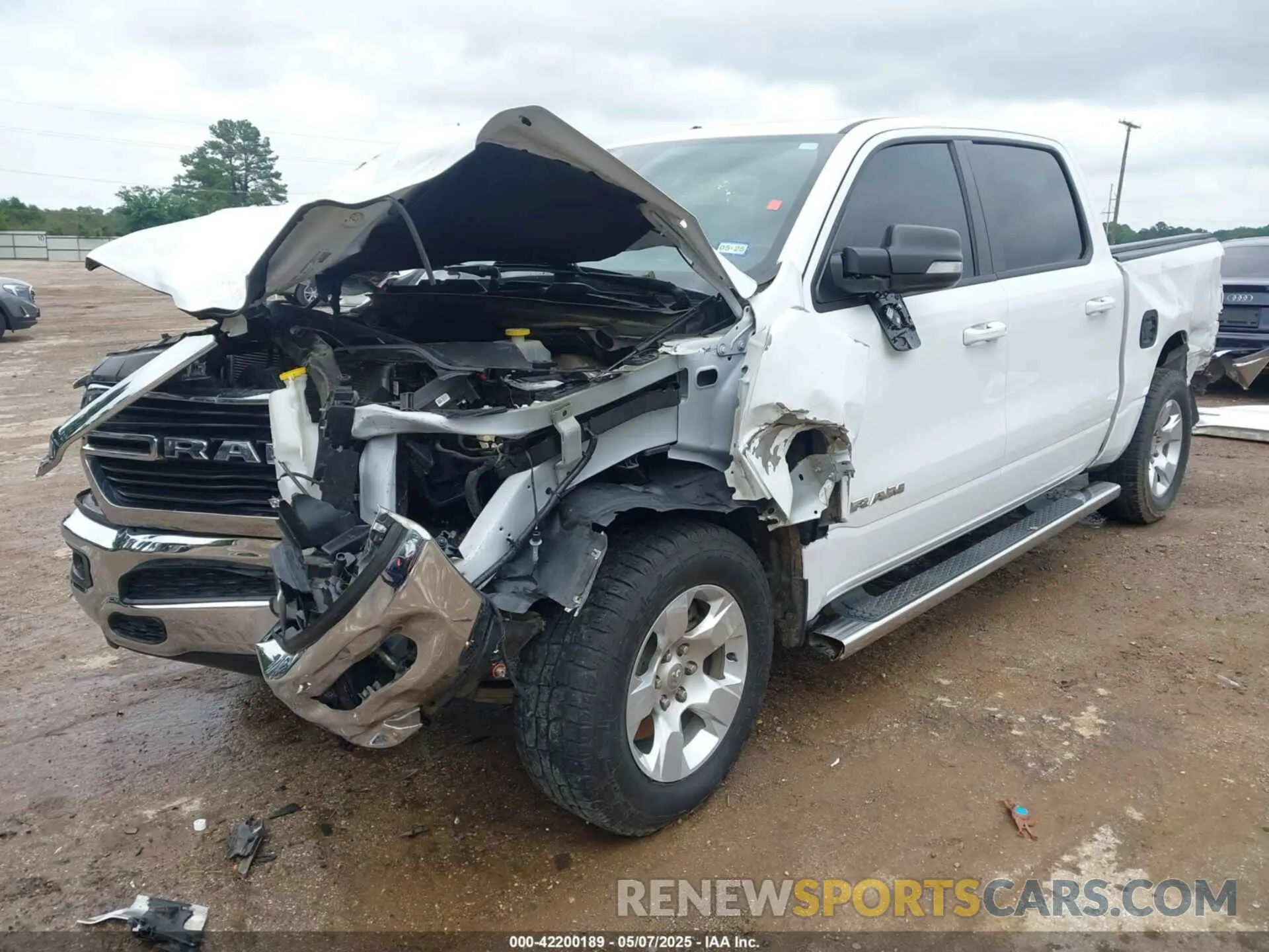 2 Photograph of a damaged car 1C6SRFFTXMN744336 RAM 1500 2021
