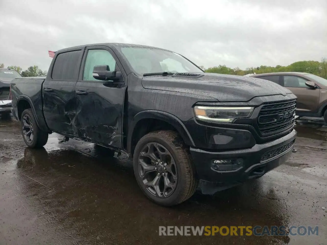 4 Photograph of a damaged car 1C6SRFHT5MN590678 RAM 1500 2021