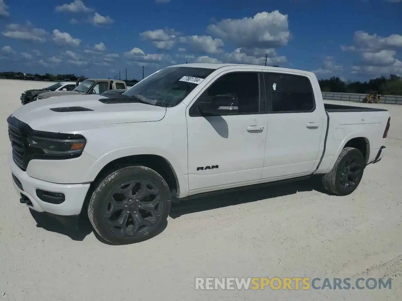 1 Photograph of a damaged car 1C6SRFHT8MN614519 RAM 1500 2021