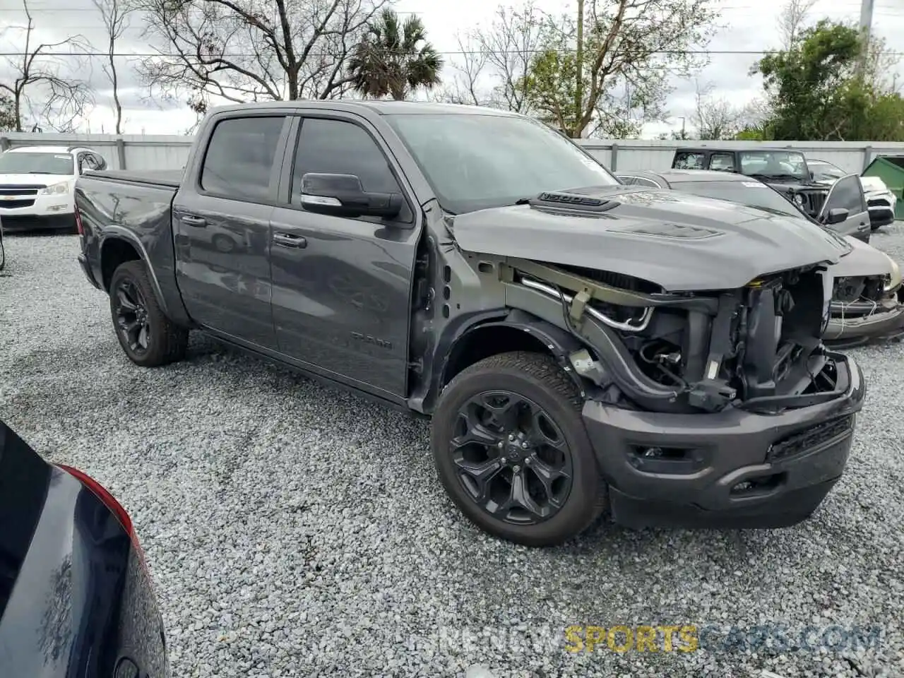 4 Photograph of a damaged car 1C6SRFHT9MN552032 RAM 1500 2021