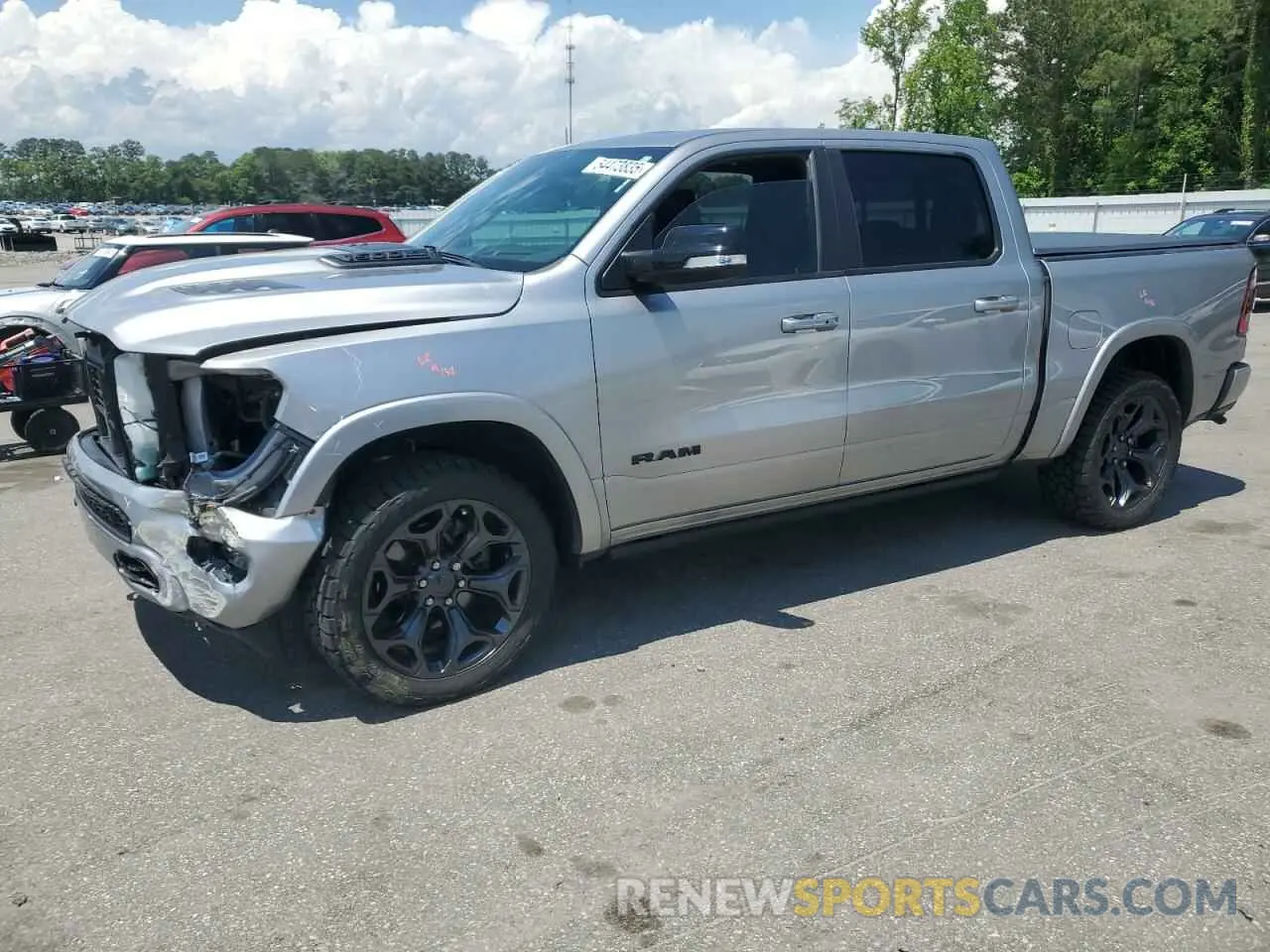 1 Photograph of a damaged car 1C6SRFHT9MN580865 RAM 1500 2021