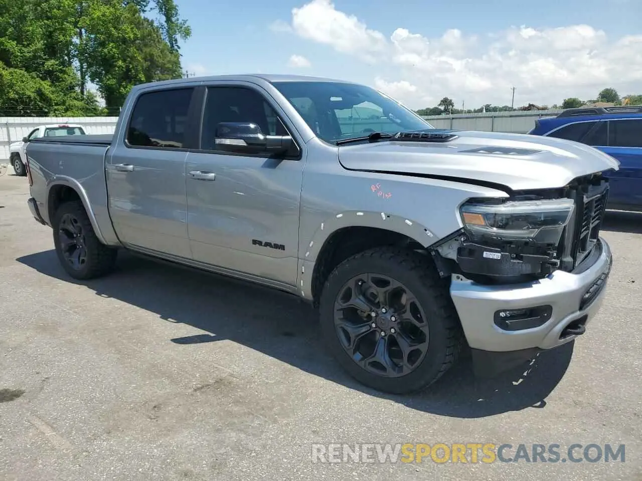 4 Photograph of a damaged car 1C6SRFHT9MN580865 RAM 1500 2021