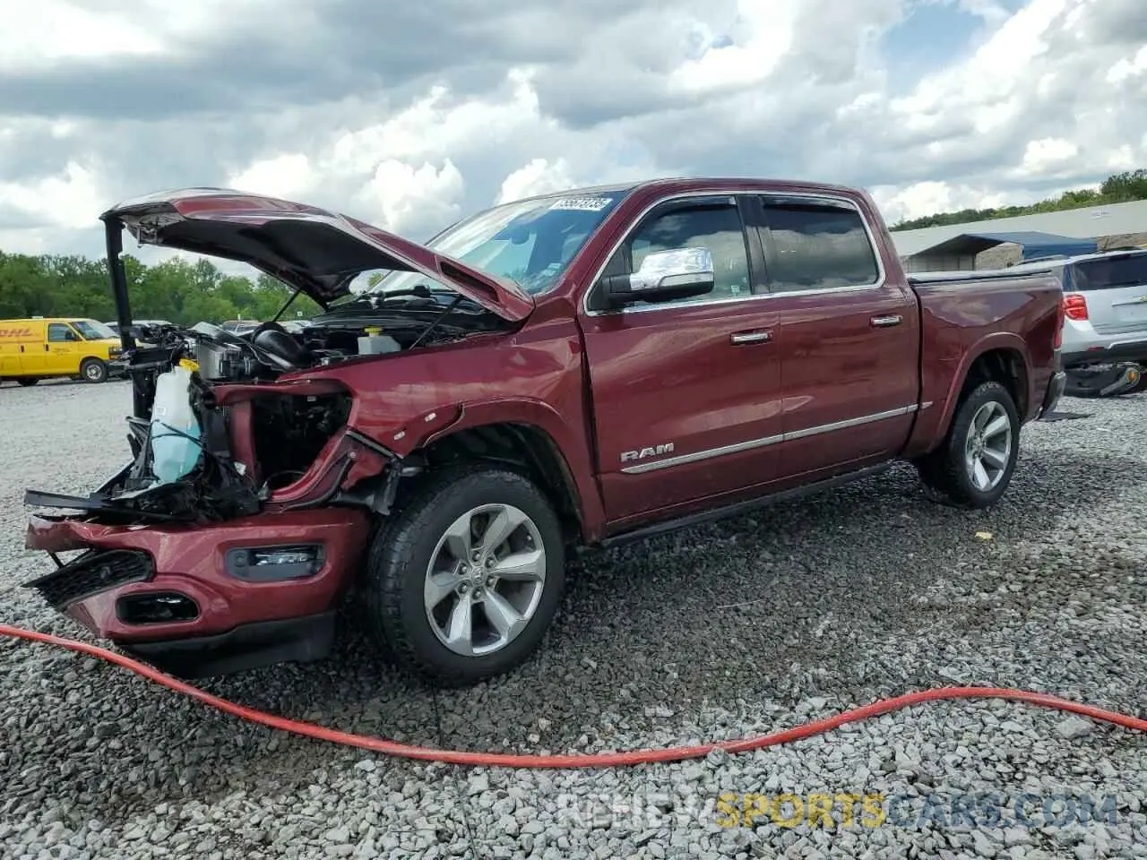 1 Photograph of a damaged car 1C6SRFHT9MN633502 RAM 1500 2021