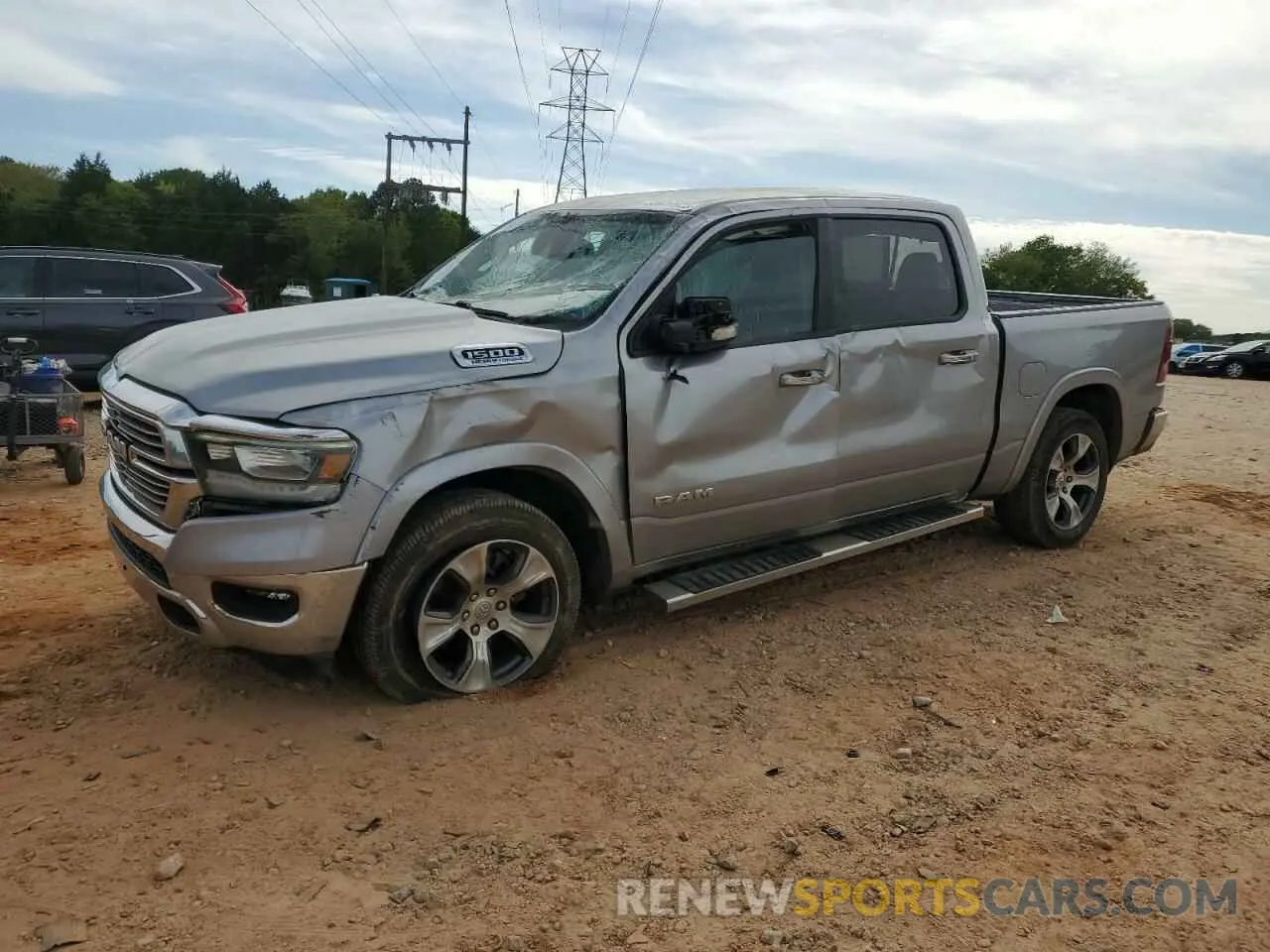 1 Photograph of a damaged car 1C6SRFJT1MN770377 RAM 1500 2021