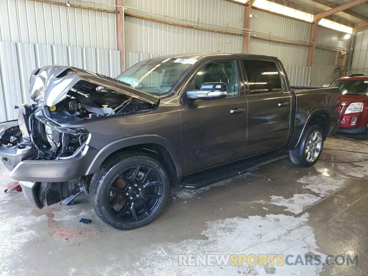 1 Photograph of a damaged car 1C6SRFJT2MN657943 RAM 1500 2021