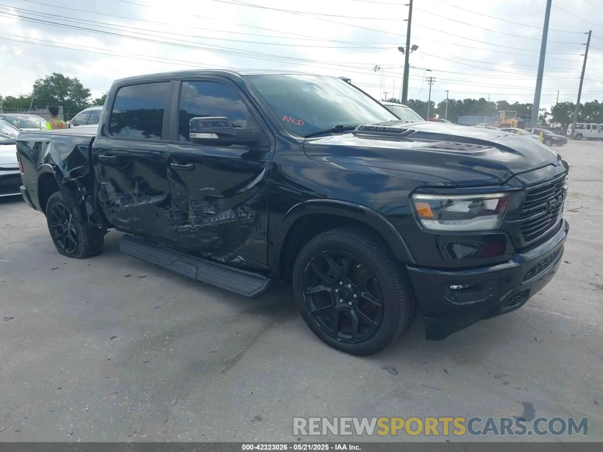 1 Photograph of a damaged car 1C6SRFJT3MN520395 RAM 1500 2021