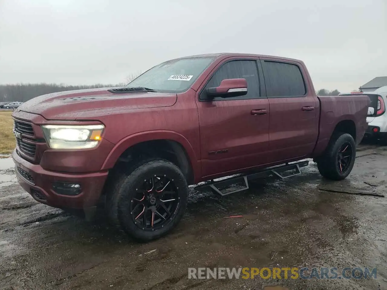 1 Photograph of a damaged car 1C6SRFJT4MN793734 RAM 1500 2021