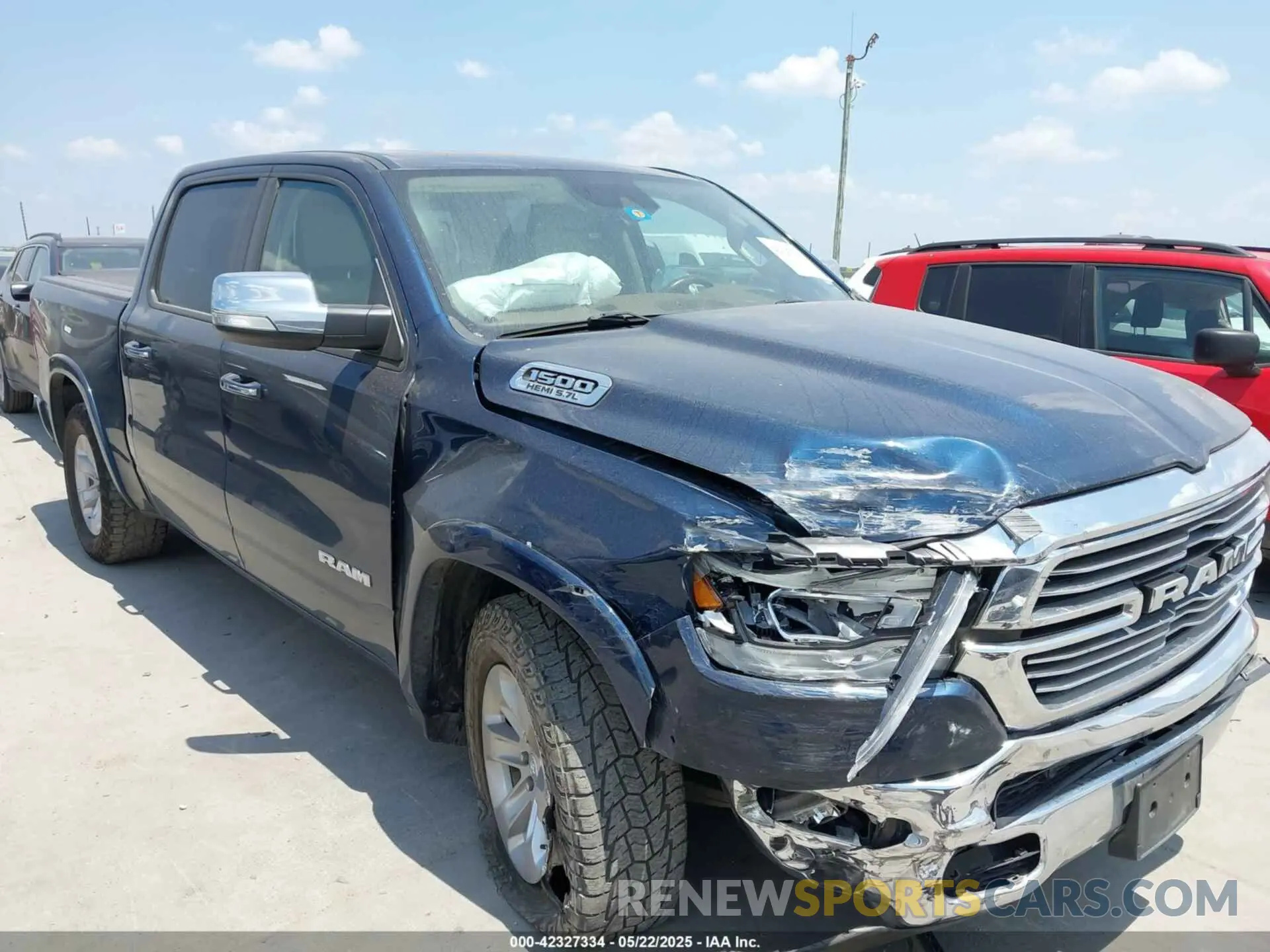 1 Photograph of a damaged car 1C6SRFJT6MN821694 RAM 1500 2021