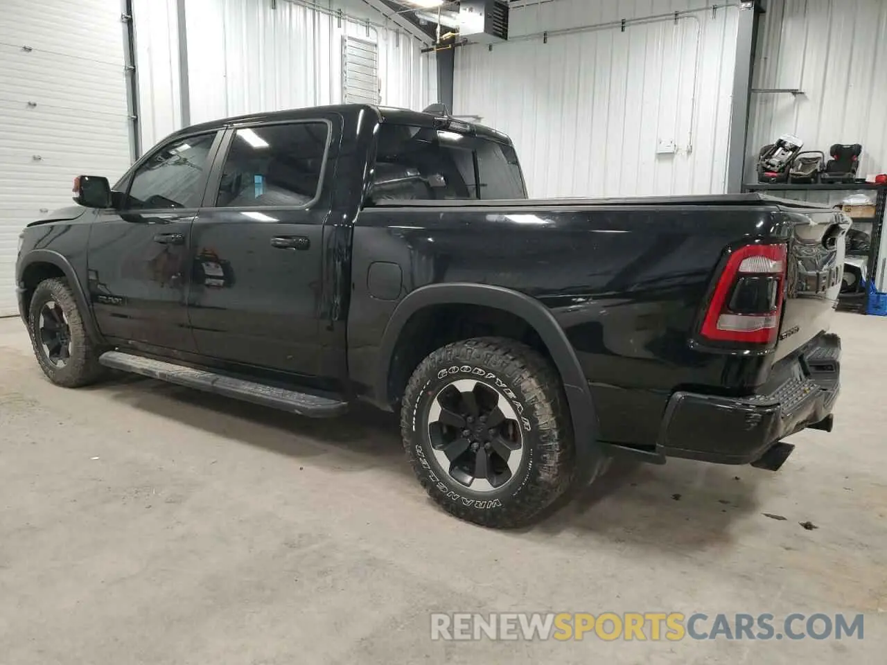 2 Photograph of a damaged car 1C6SRFJTXMN634443 RAM 1500 2021