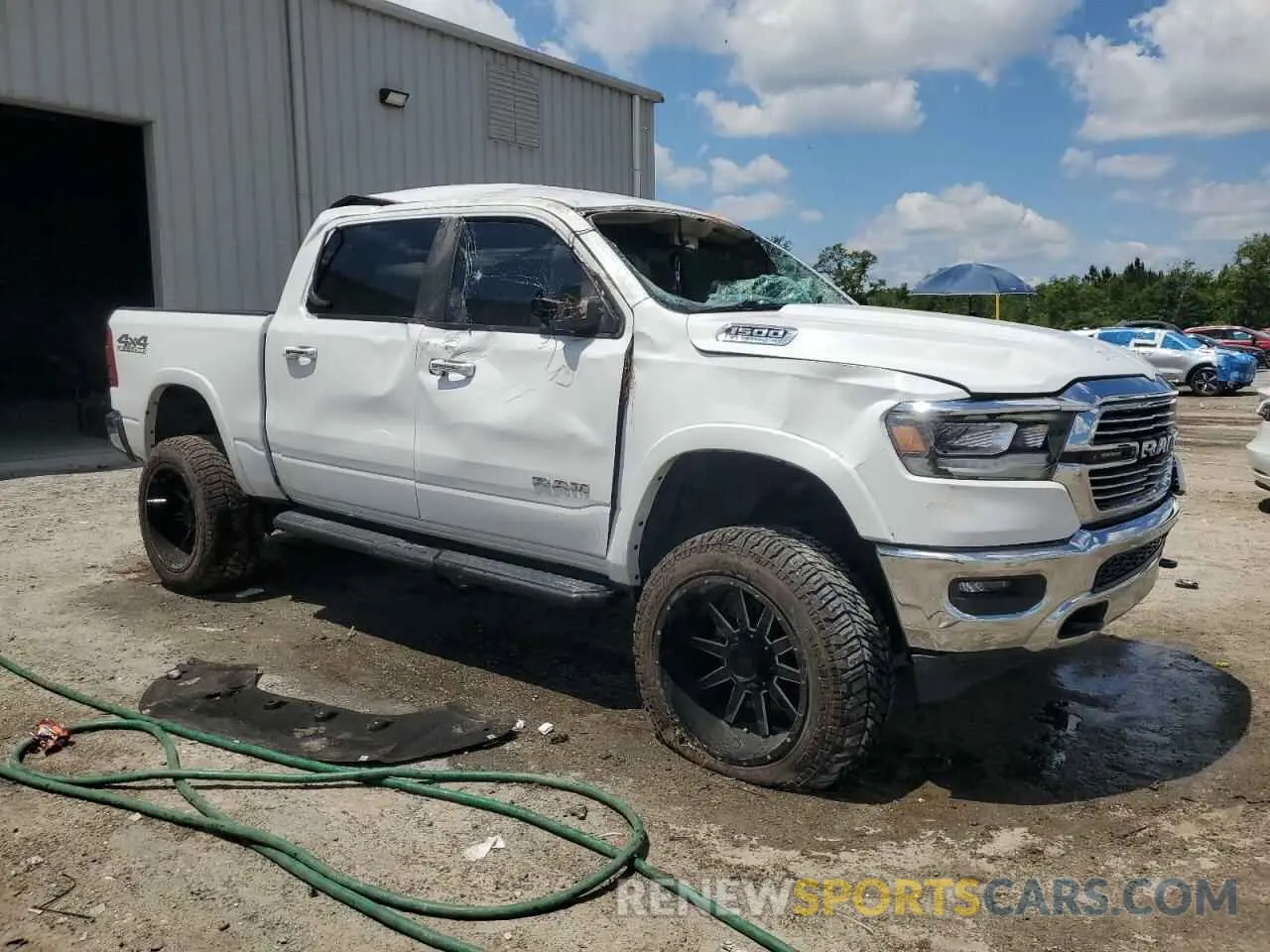 4 Photograph of a damaged car 1C6SRFJTXMN719184 RAM 1500 2021