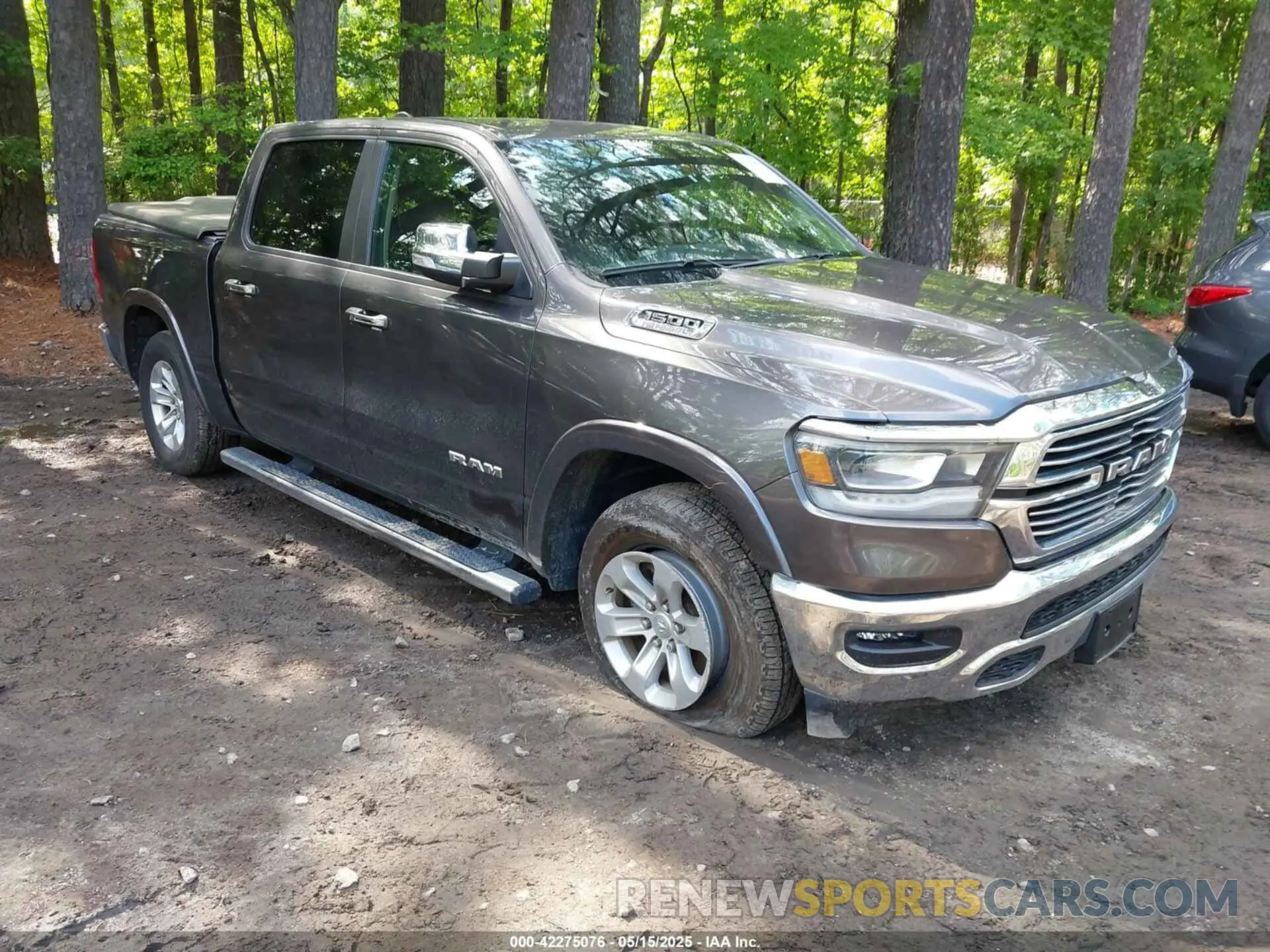 1 Photograph of a damaged car 1C6SRFJTXMN734090 RAM 1500 2021