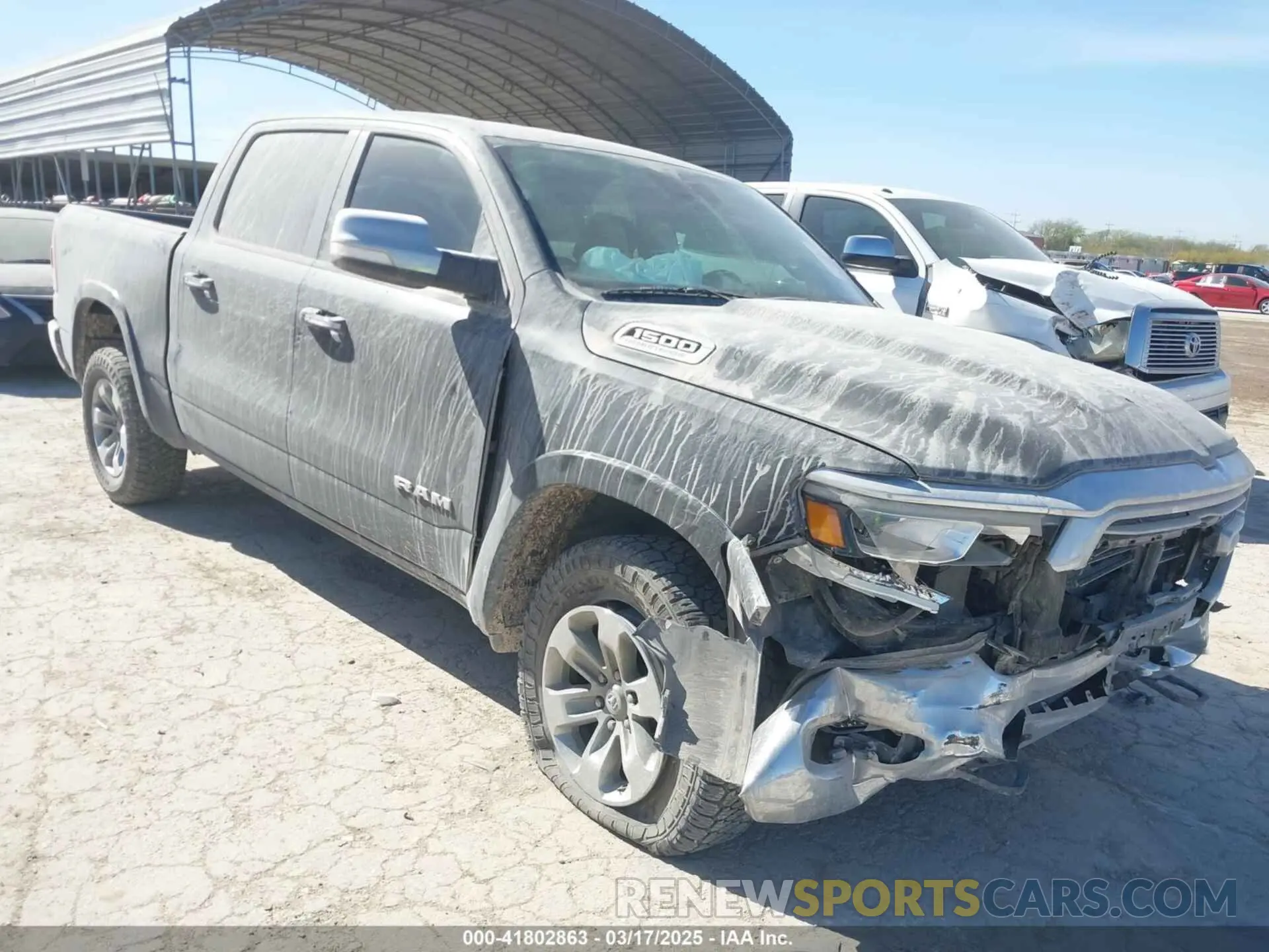 1 Photograph of a damaged car 1C6SRFJTXMN751178 RAM 1500 2021