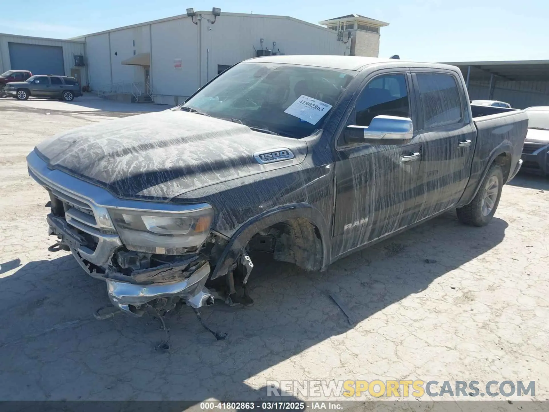 2 Photograph of a damaged car 1C6SRFJTXMN751178 RAM 1500 2021