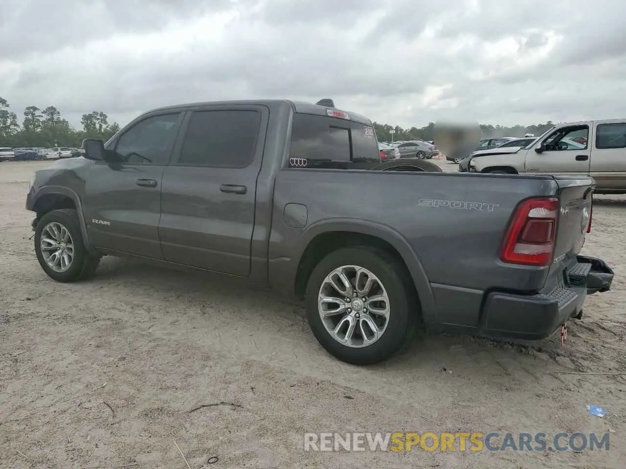 2 Photograph of a damaged car 1C6SRFJTXMN799294 RAM 1500 2021