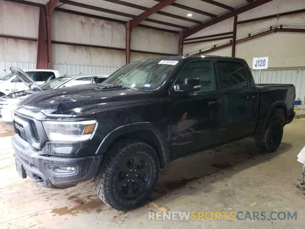 1 Photograph of a damaged car 1C6SRFLM0MN746027 RAM 1500 2021