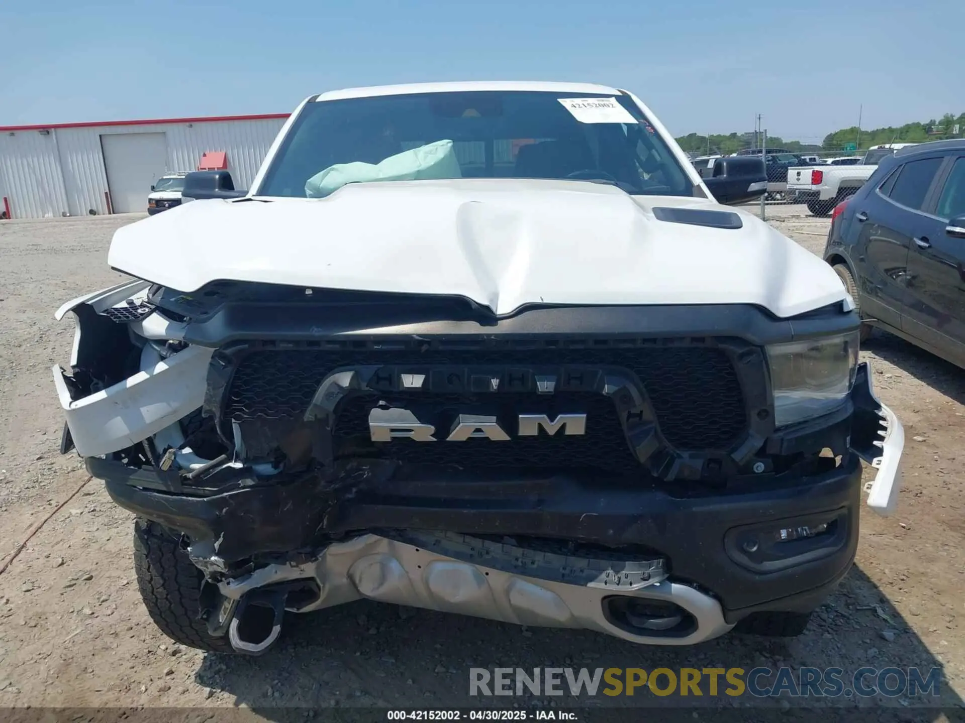 13 Photograph of a damaged car 1C6SRFLT0MN559314 RAM 1500 2021
