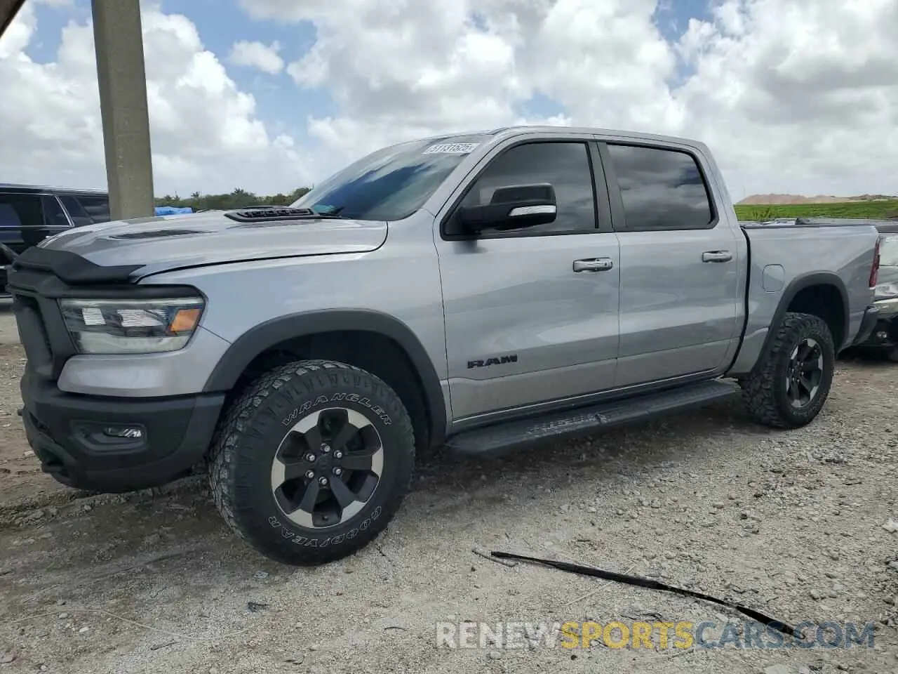 1 Photograph of a damaged car 1C6SRFLT0MN570040 RAM 1500 2021