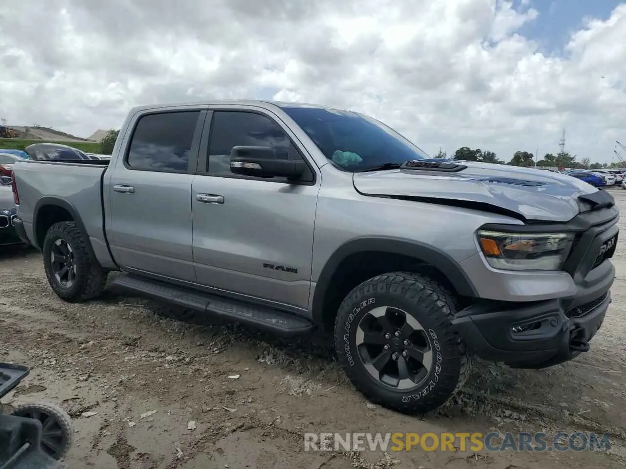 4 Photograph of a damaged car 1C6SRFLT0MN570040 RAM 1500 2021