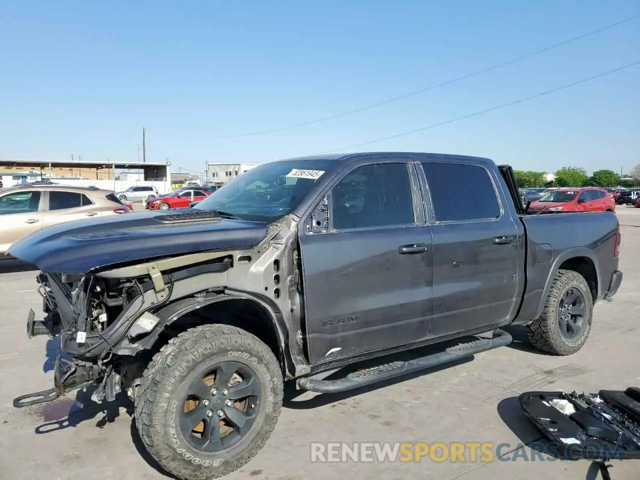 1 Photograph of a damaged car 1C6SRFLT0MN585881 RAM 1500 2021