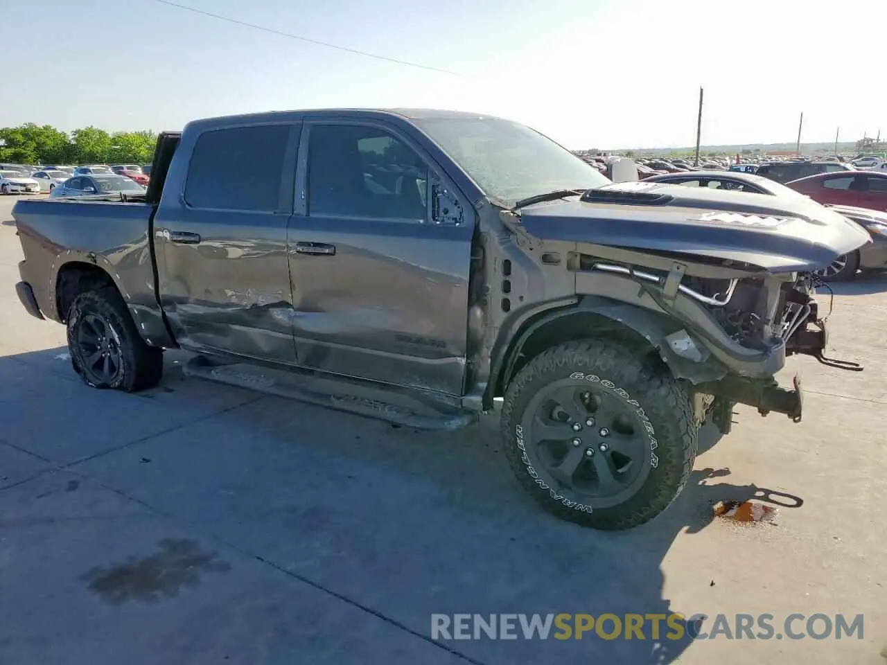 4 Photograph of a damaged car 1C6SRFLT0MN585881 RAM 1500 2021
