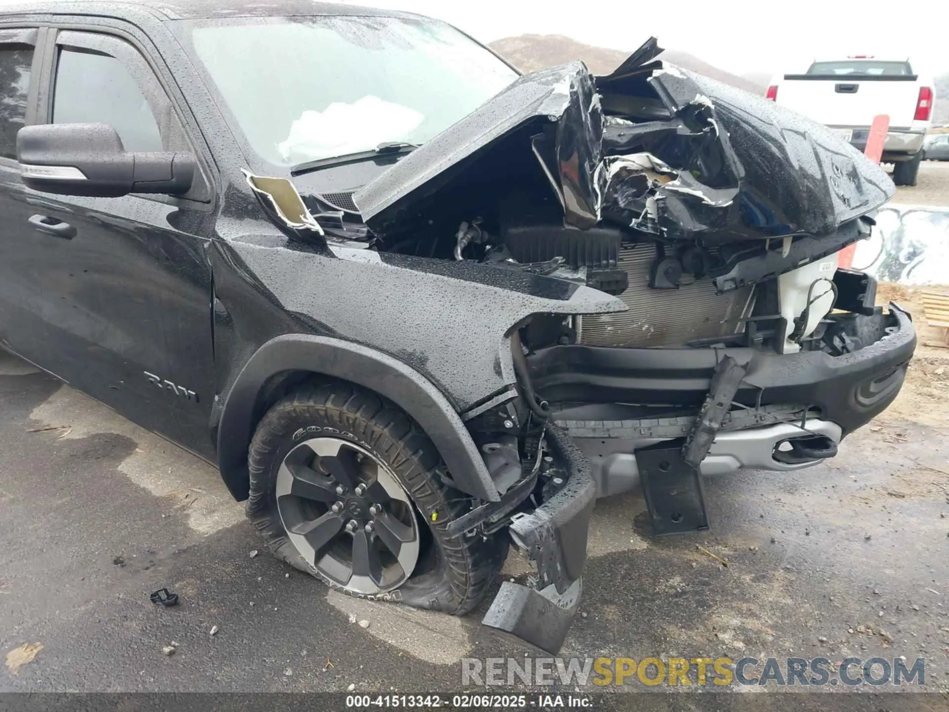 12 Photograph of a damaged car 1C6SRFLT0MN614070 RAM 1500 2021