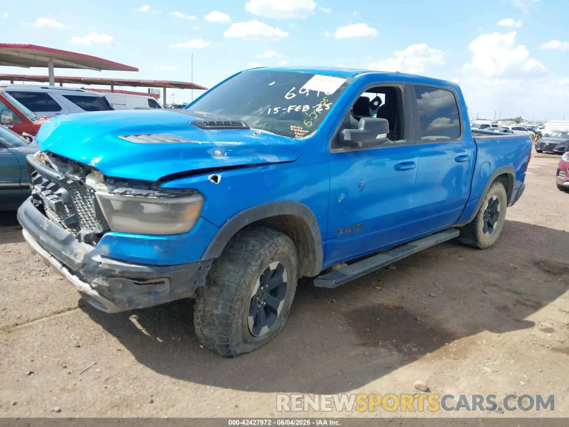 2 Photograph of a damaged car 1C6SRFLT3MN573143 RAM 1500 2021