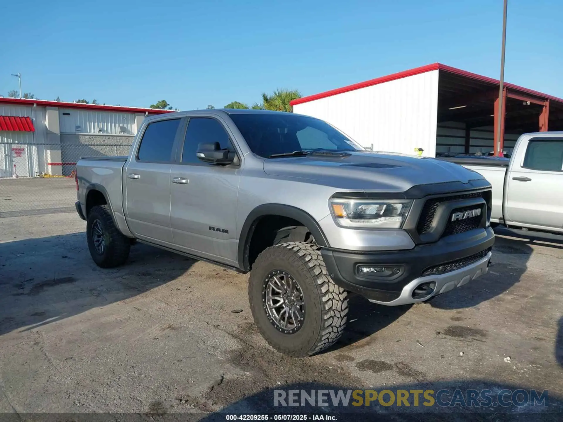1 Photograph of a damaged car 1C6SRFLT3MN778445 RAM 1500 2021