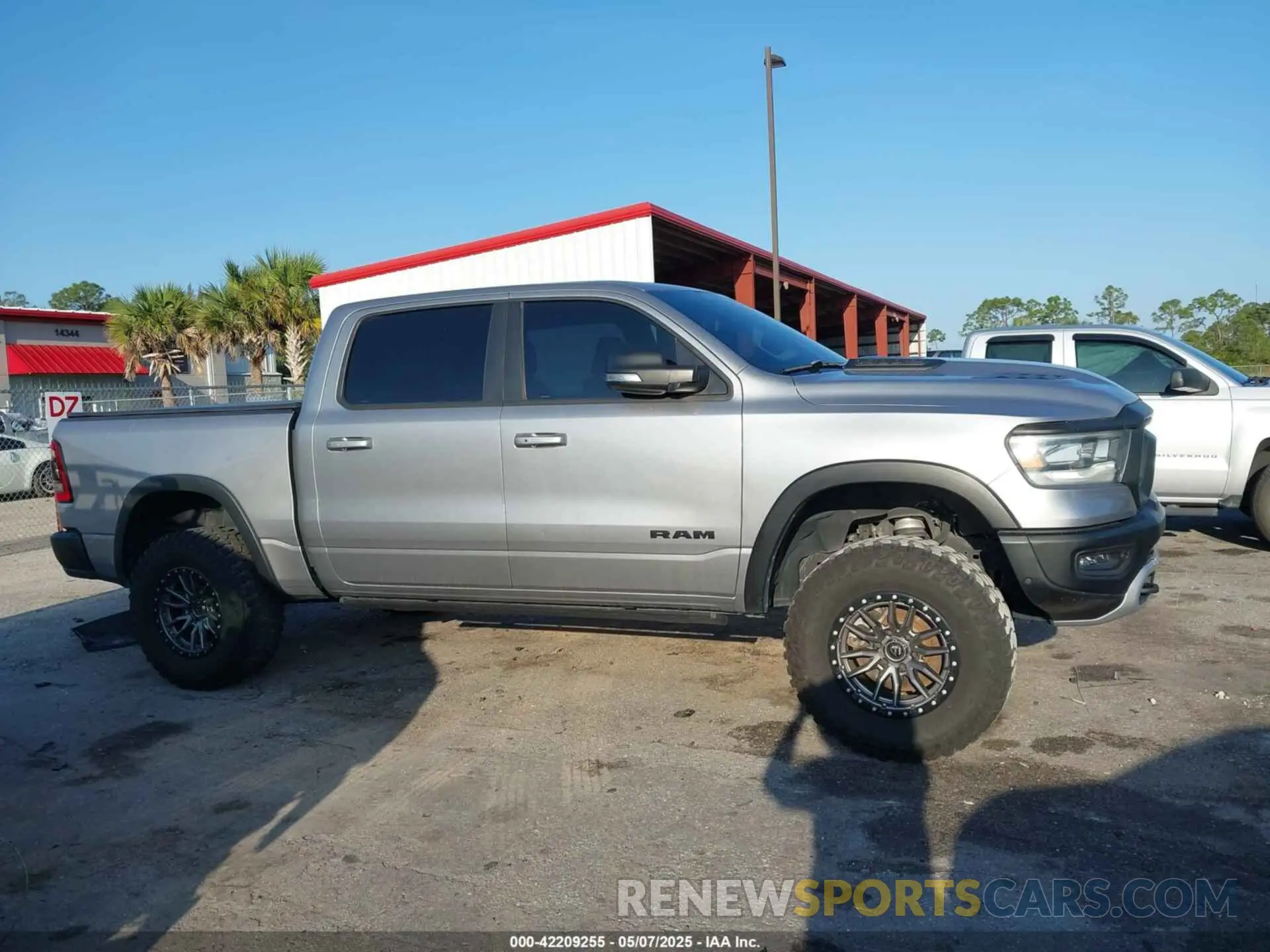 12 Photograph of a damaged car 1C6SRFLT3MN778445 RAM 1500 2021