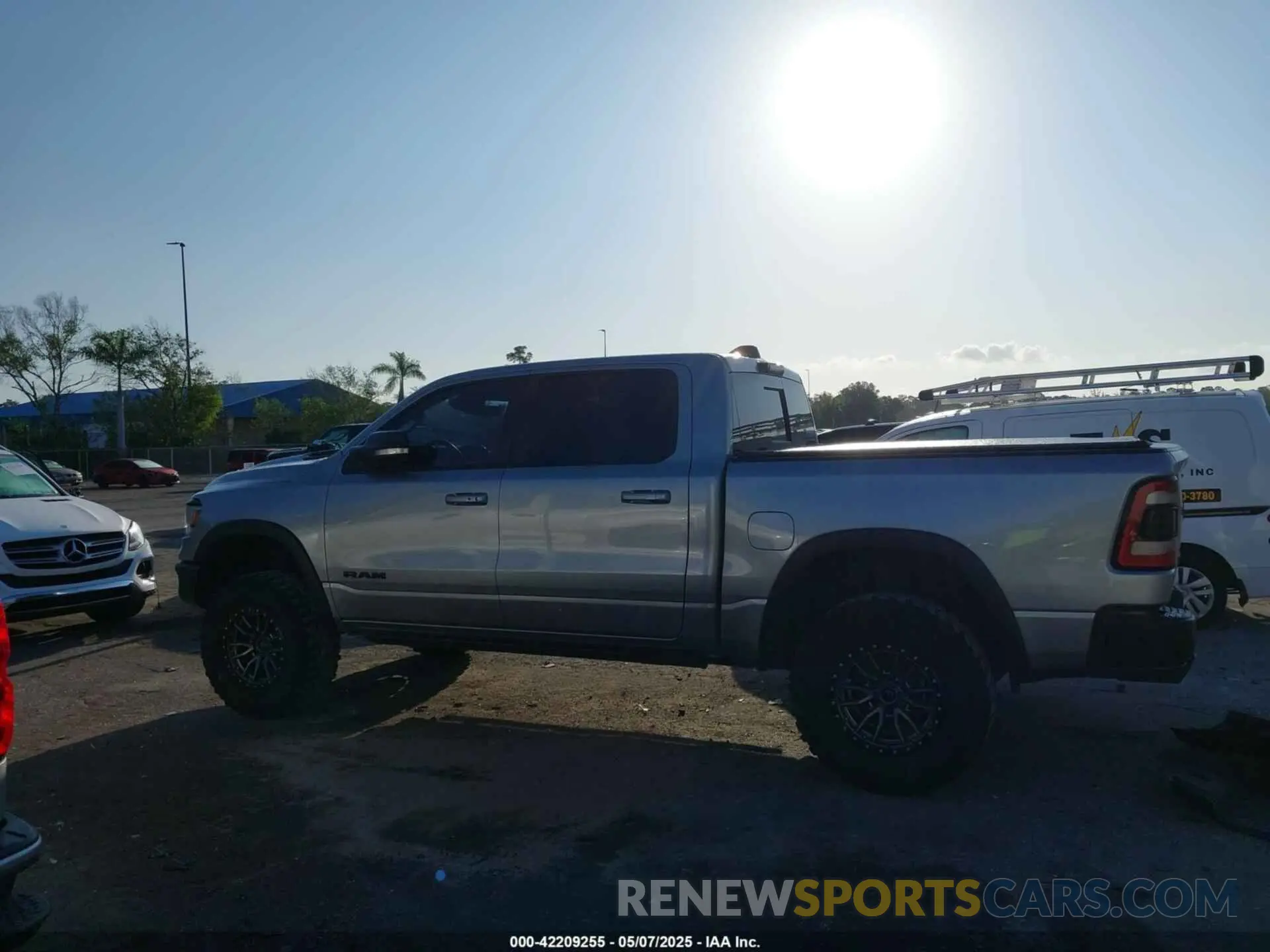 13 Photograph of a damaged car 1C6SRFLT3MN778445 RAM 1500 2021