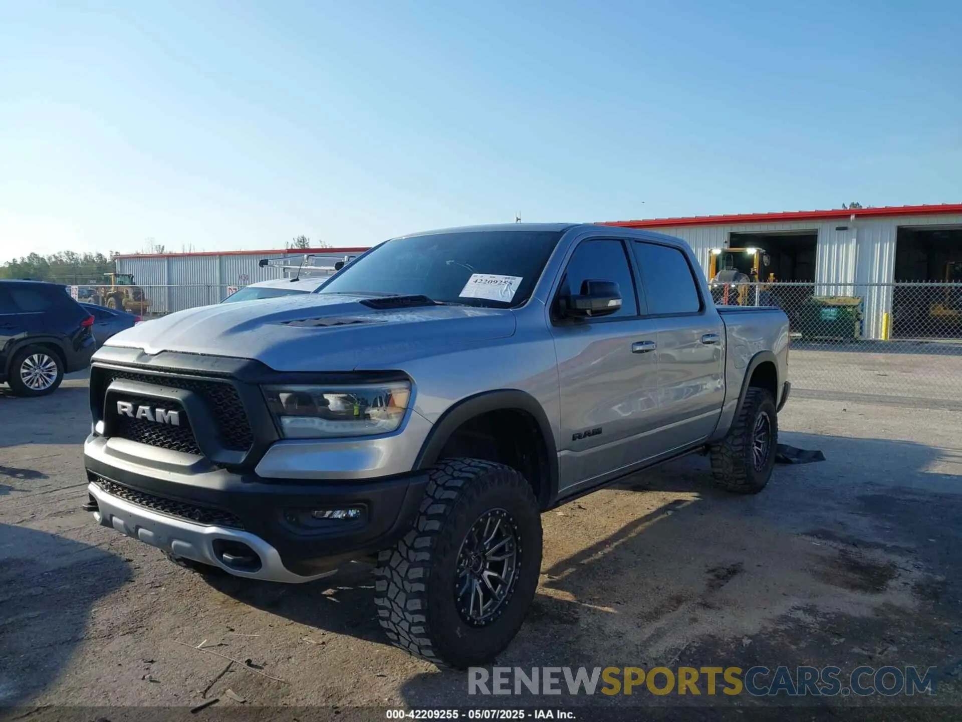 2 Photograph of a damaged car 1C6SRFLT3MN778445 RAM 1500 2021