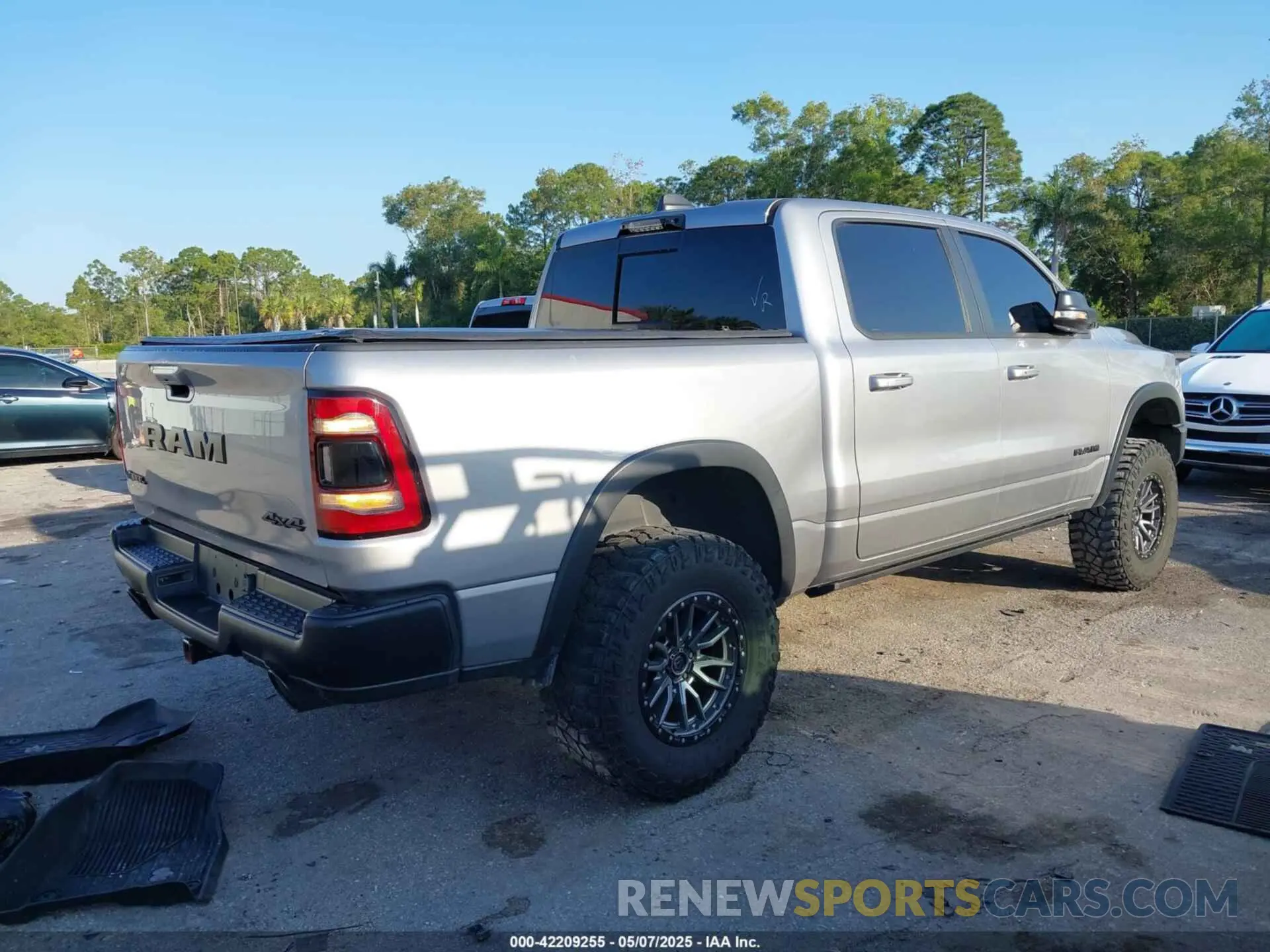 4 Photograph of a damaged car 1C6SRFLT3MN778445 RAM 1500 2021