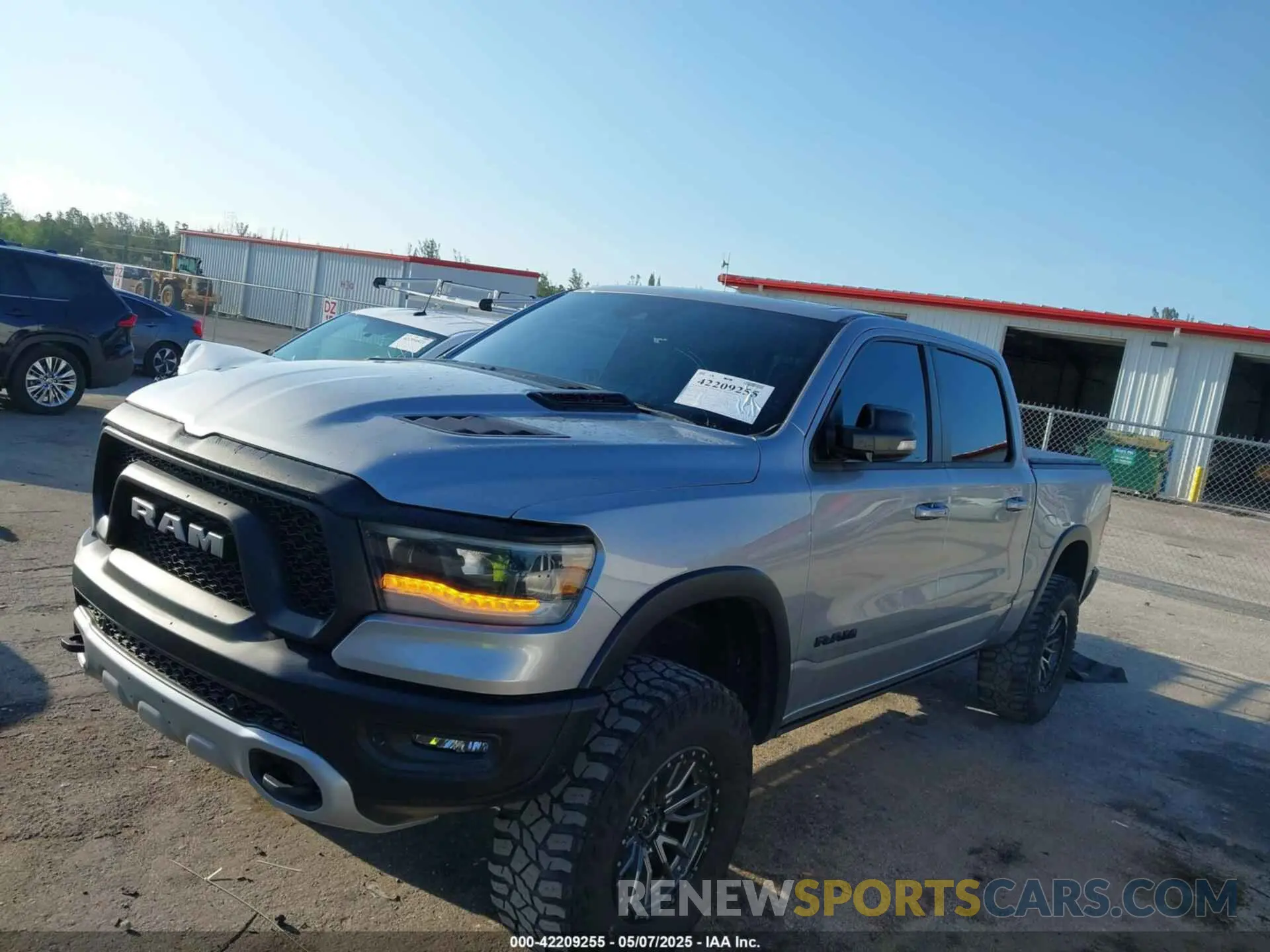 6 Photograph of a damaged car 1C6SRFLT3MN778445 RAM 1500 2021