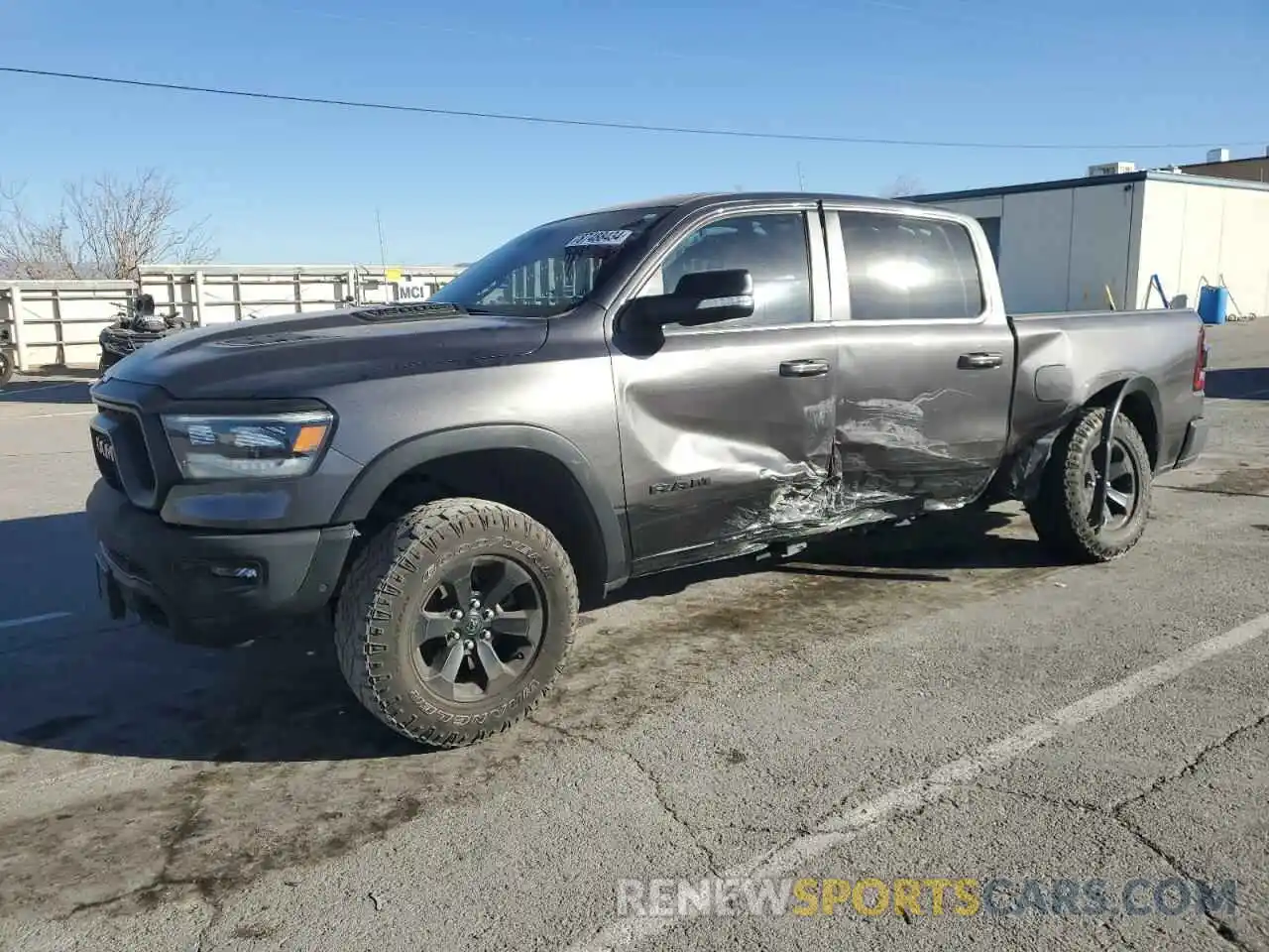 1 Photograph of a damaged car 1C6SRFLT4MN563379 RAM 1500 2021